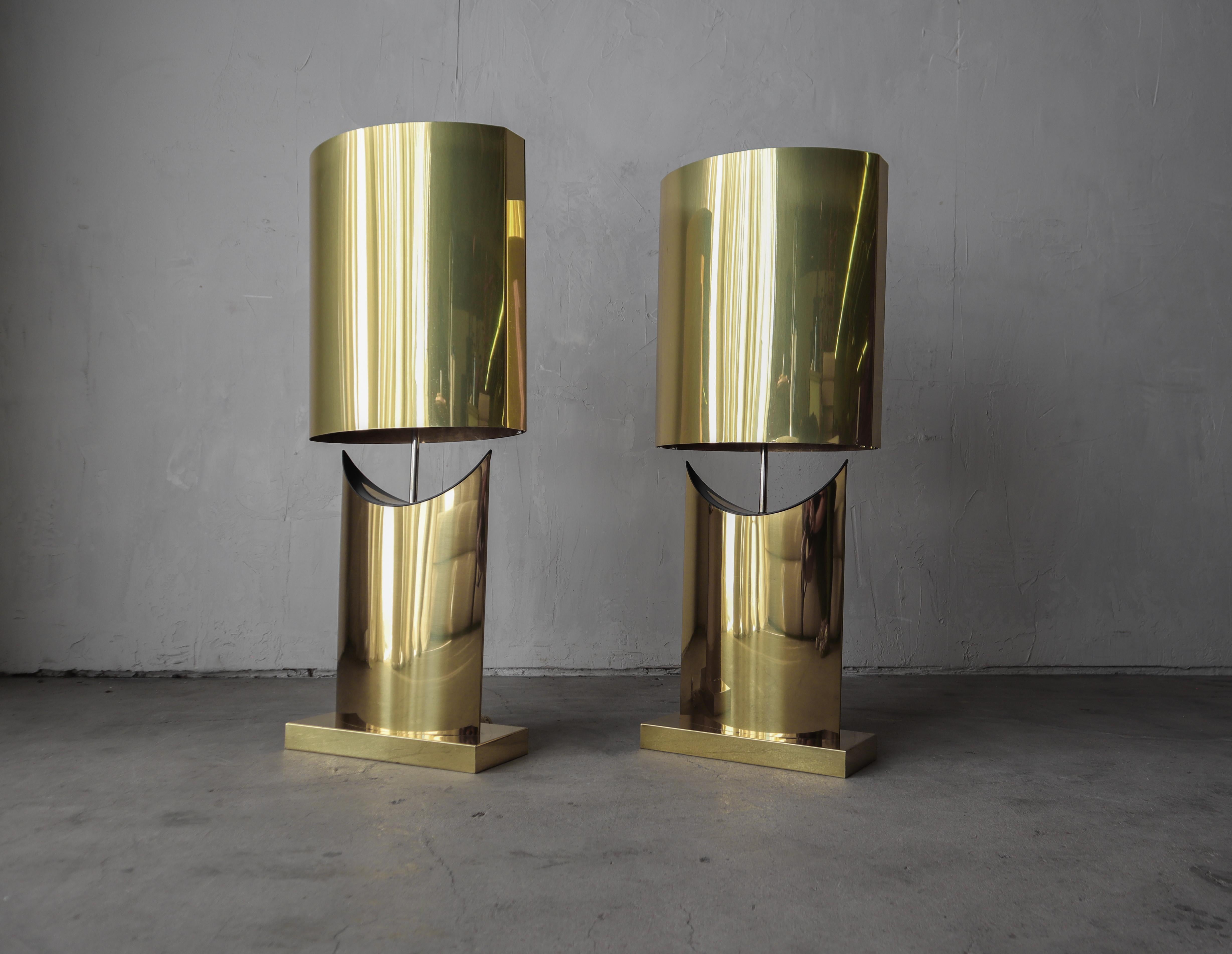 Absolutely stunning and very large pair of brass table lamps by Curtis Jere.  These lamps command attention serving both form and function with their sculptural shape and warm brass color.

Lamps are in excellent condition overall showing very