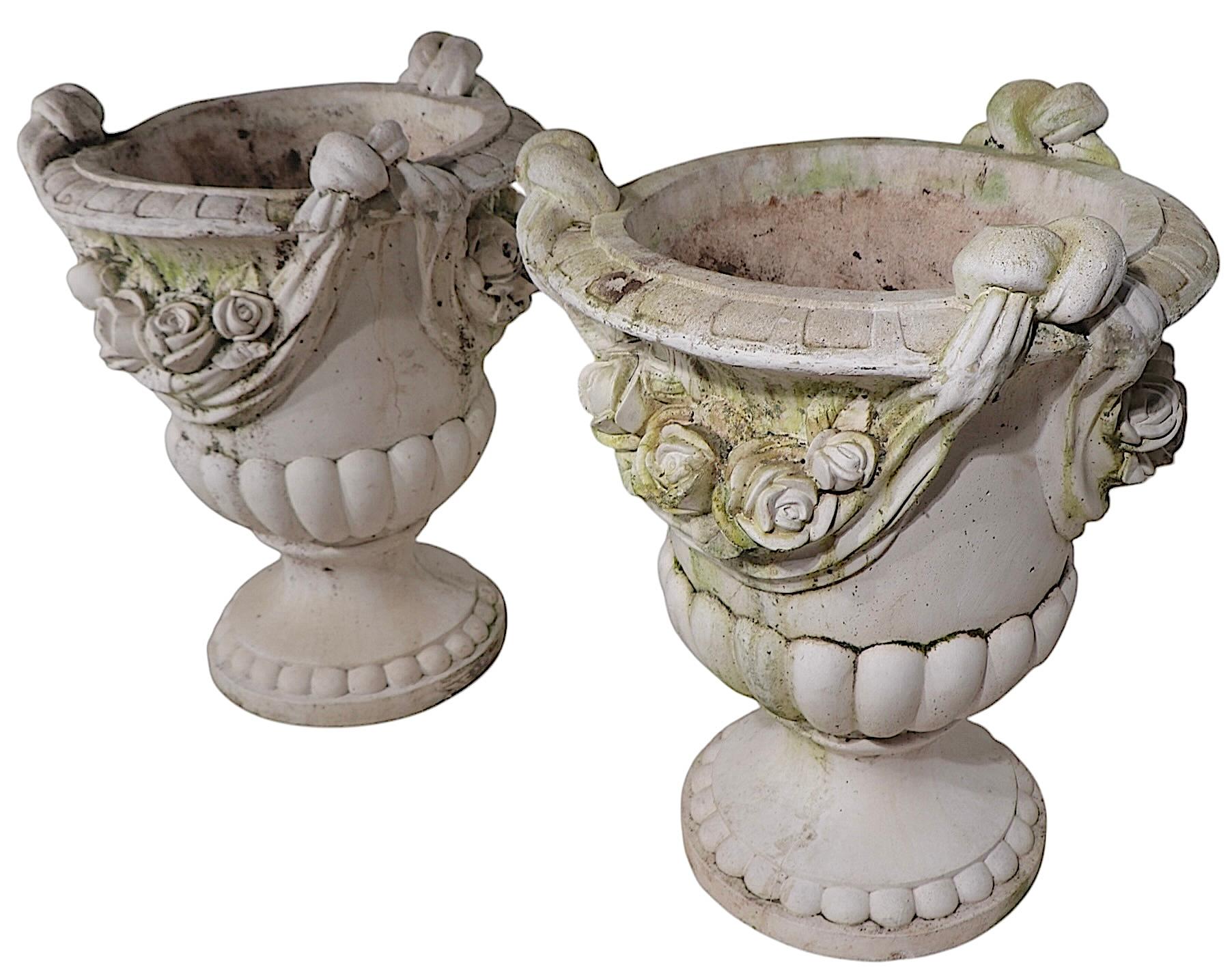 French Monumental Pair of Cast Stone Urn Form Planters with Flower and Swag Decoration For Sale