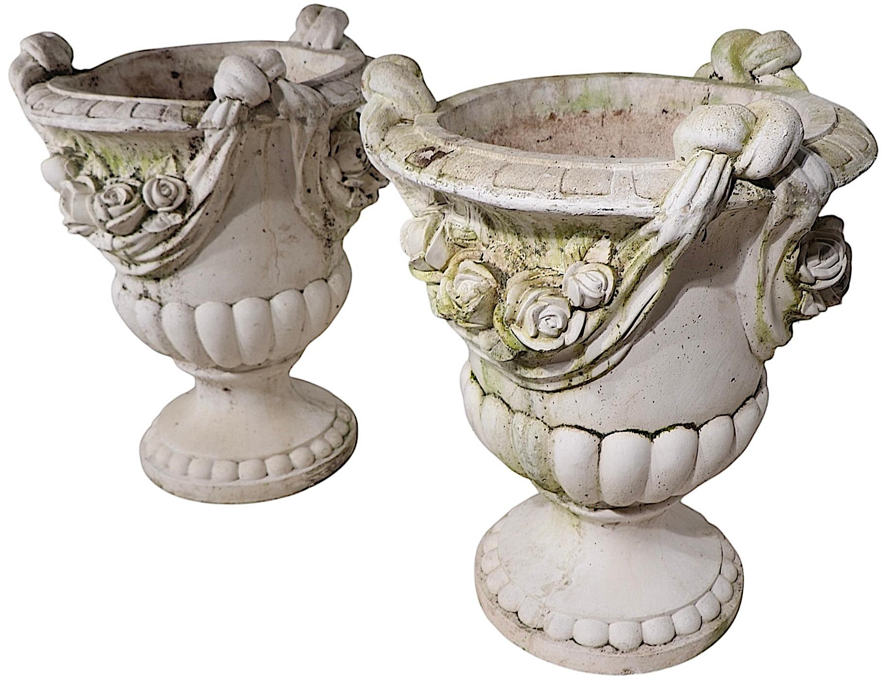 20th Century Monumental Pair of Cast Stone Urn Form Planters with Flower and Swag Decoration For Sale