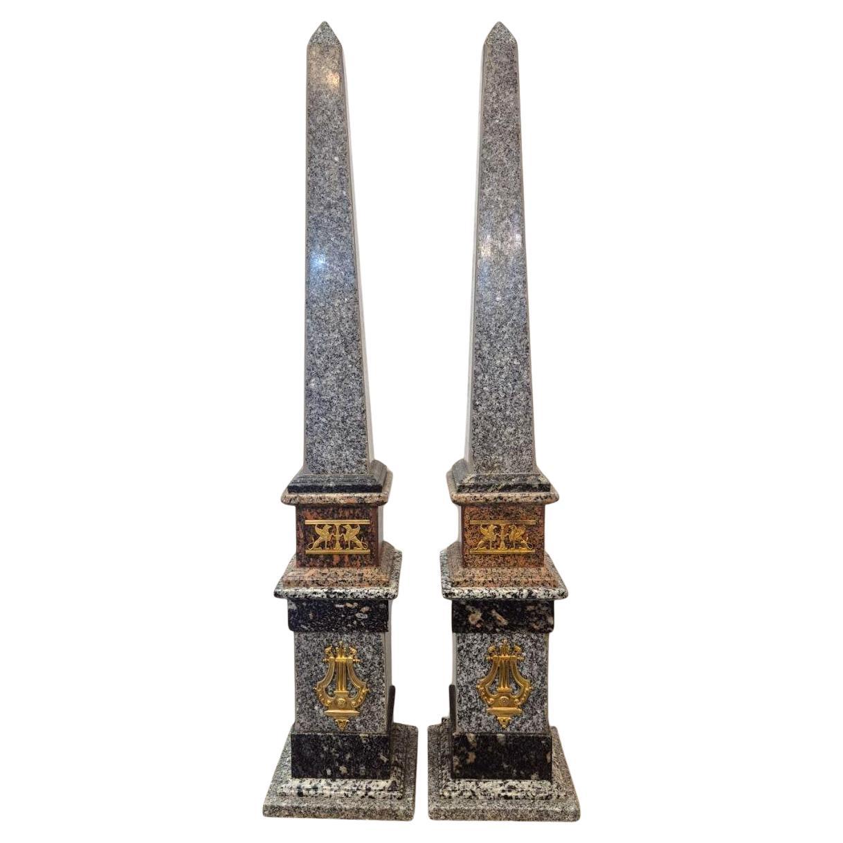 Monumental pair of Empire style porphyry and bronze obelisks, 19th century For Sale