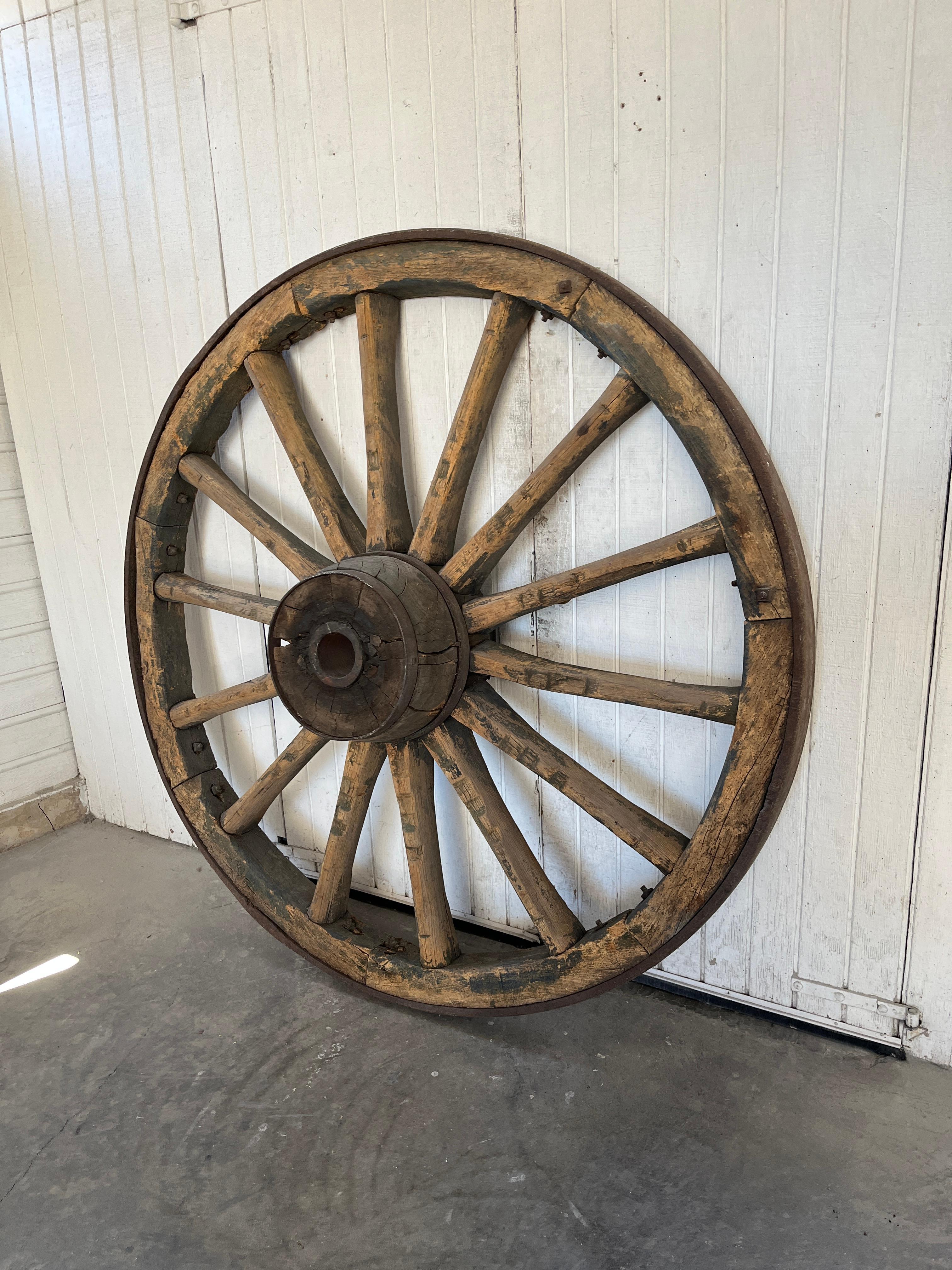 Monumental Pair of French Wagon Wheels In Distressed Condition For Sale In Los Angeles, CA