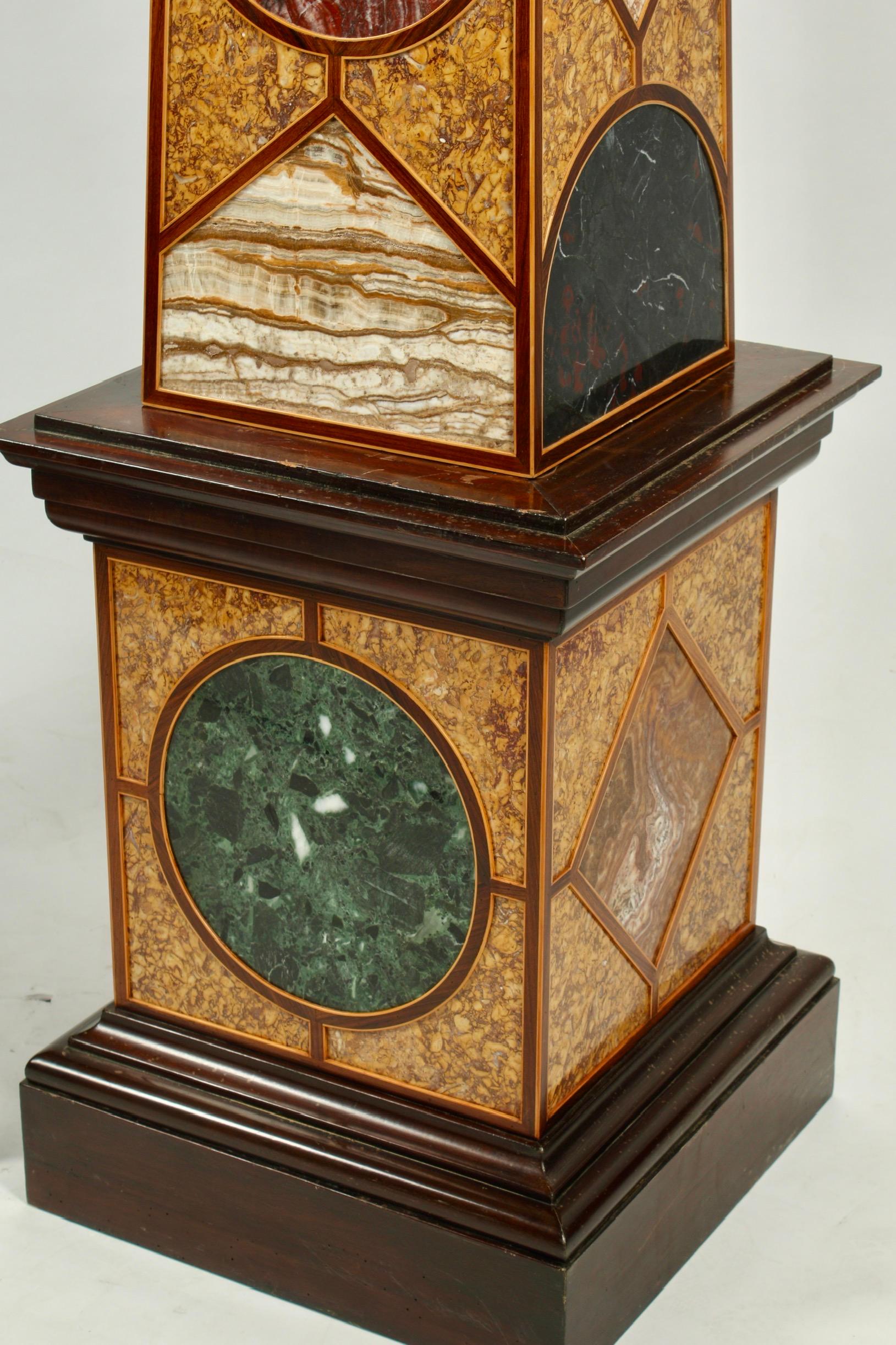 Unique monumental Italian 19th Century Grand Tour Style Specimen marble inlaid obelisks. Marble is precisely cut and inlaid into a fine two-toned wood veneer border. The artist spares no attention to detail by meticulously matching the marble inlays