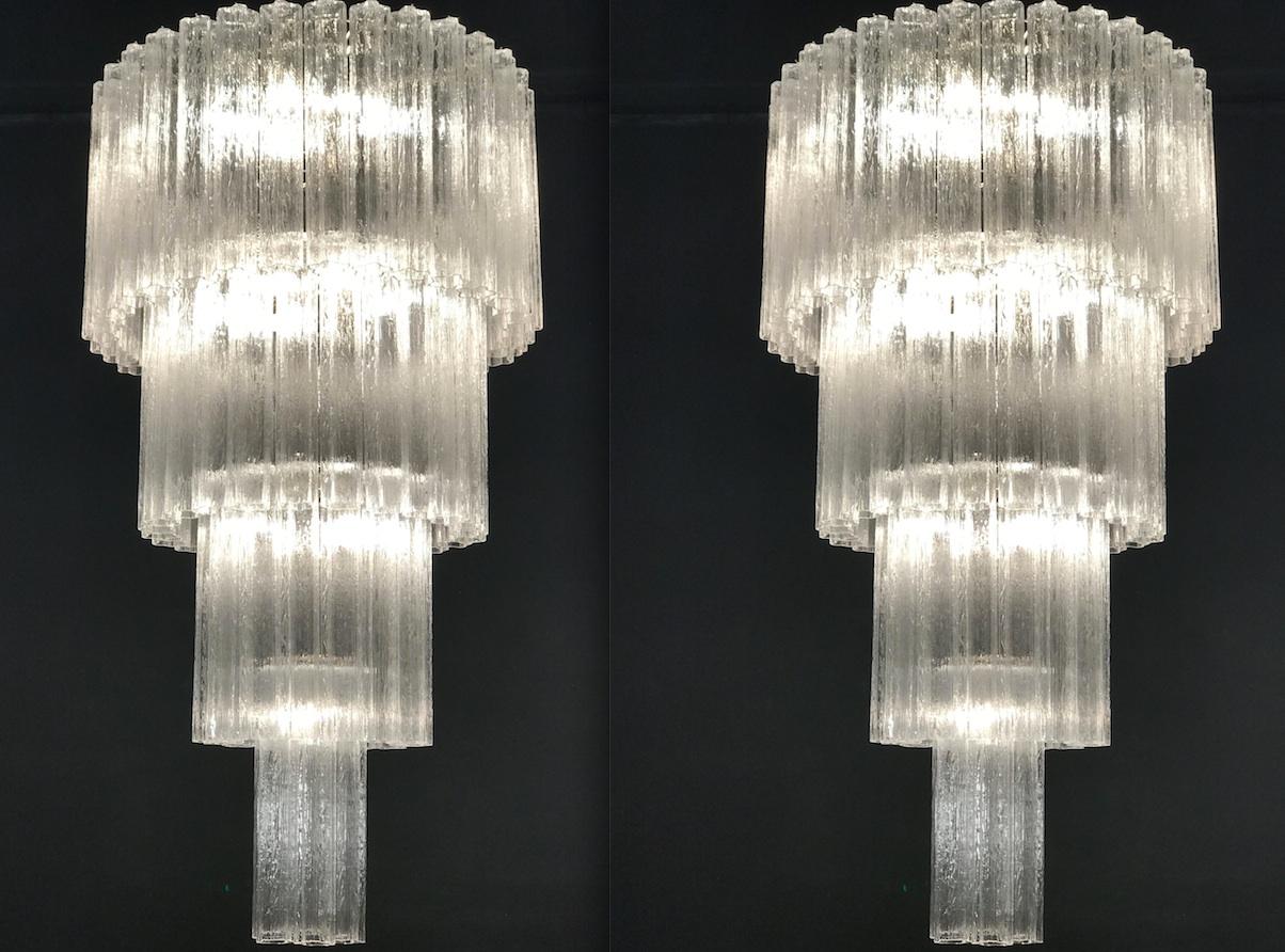 This extraordinary pair of chandeliers is composed by 78 'Tronchi' by 40 cm high.
Eighteen-light bulbs E 14.
Measure: Height 160 cm without chain.
 Price is for 1 item.
With the same glasses are also available two pairs of appliques or scones.
 