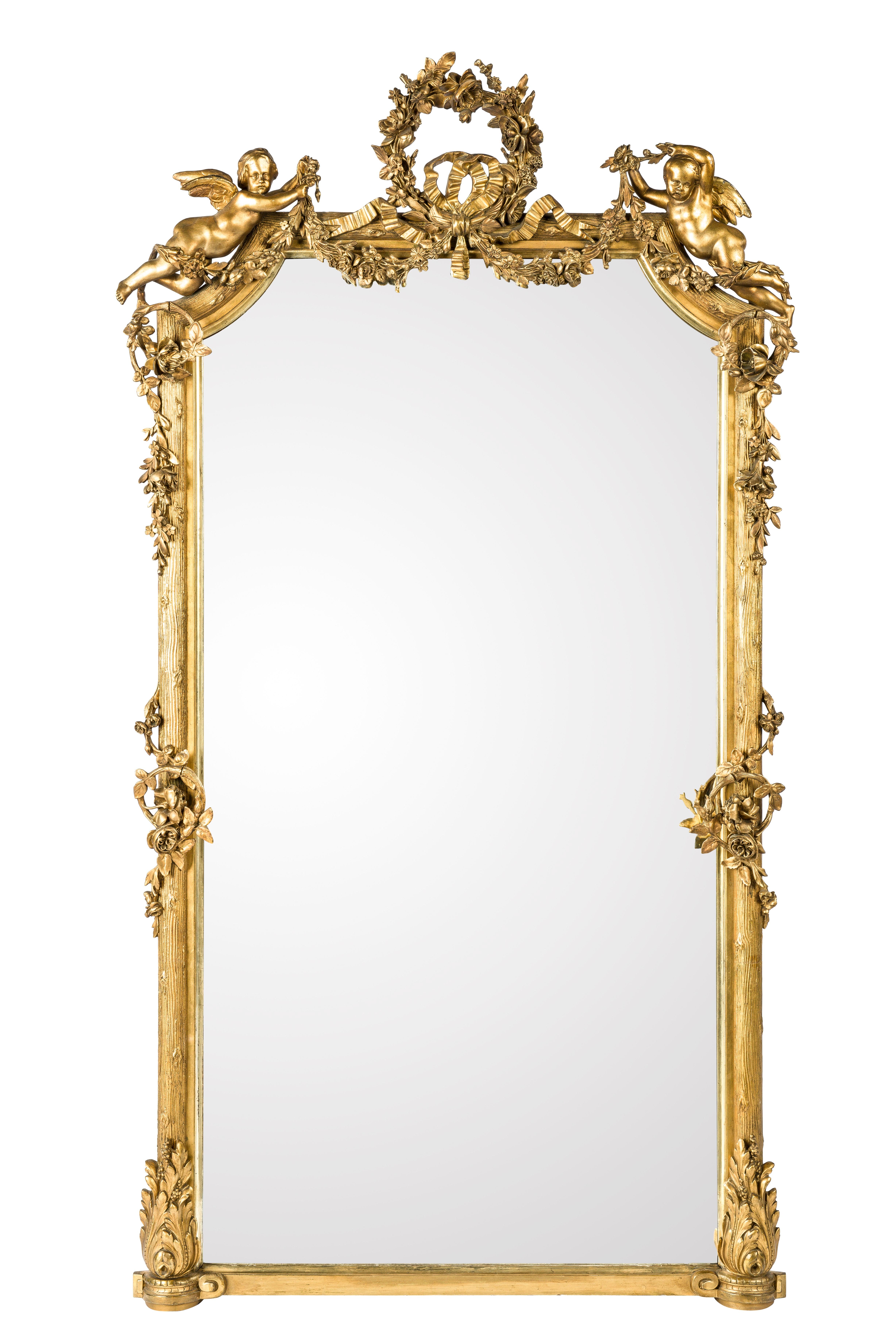 This astonishing pair of antique French mirrors is made in southern France around 1870. They are well preserved and very much authentic. The glass has a facet edge and is the original plate in both mirrors. 
The most elevated part of the frame is