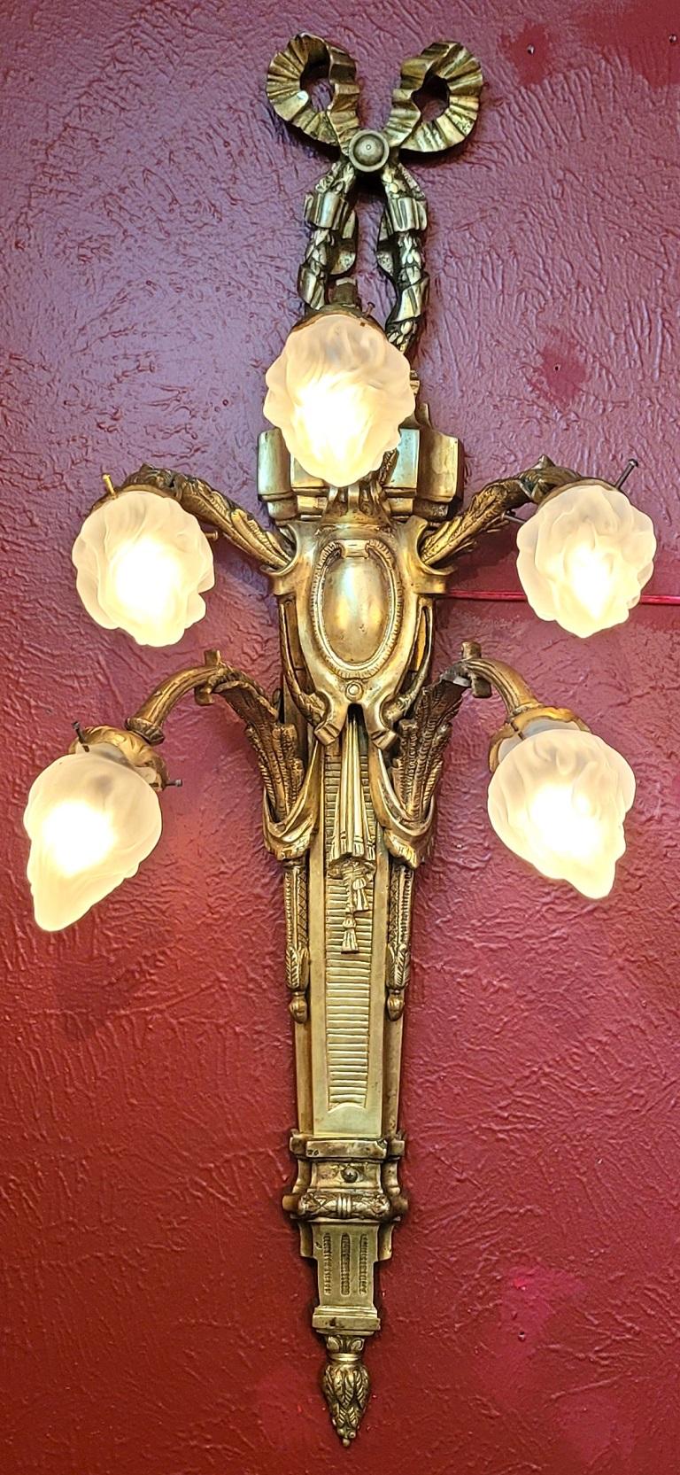 PRESENTING A EXCEPTIONAL, RARE and MONUMENTAL Pair of Late 19C French Empire Brass Wall Sconces.

These matching pair of wall sconces or wall lights are LARGE!

Made in France, circa 1890 of solid brass in the Empire Style.

Each, is three and