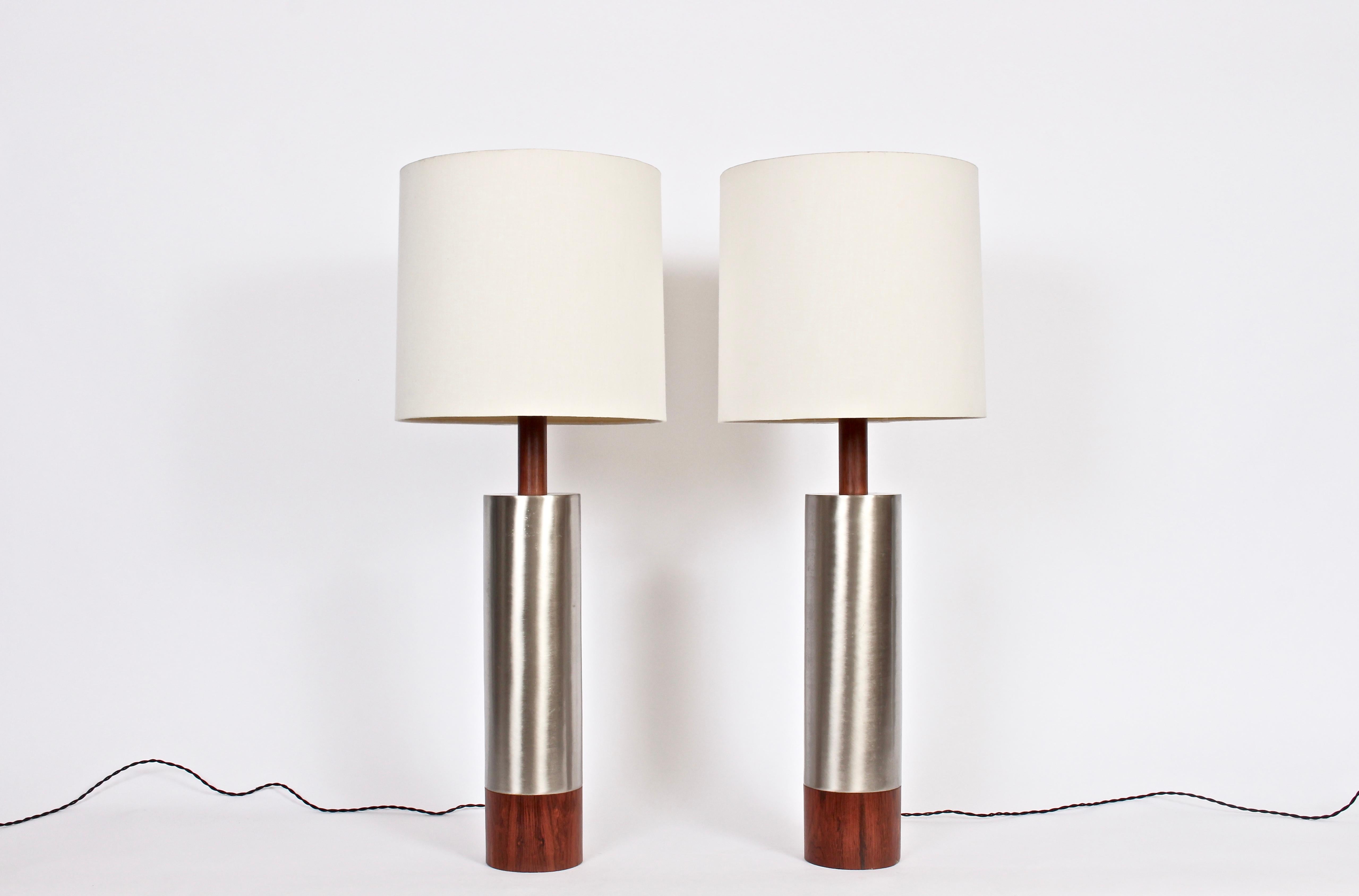 Pair of Substantial Laurel Lamp Co. tower table lamps in brushed aluminum and walnut, 1960s. 3' H. Small footprint. Featuring a slender, reflective brushed aluminum column, neck and base surrounded with thick Walnut veneer. 28 H to top of socket.