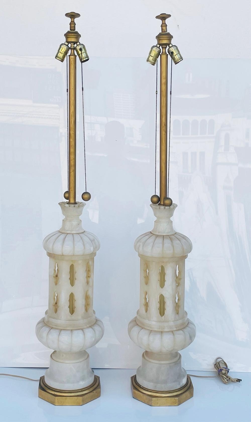Monumental Pair of Marble Lamps, Italy 1960's. These sophisticated lamps are a true testament to Italian craftsmanship and elegance. 



Crafted with utmost precision, each lamp is made from high-quality marble with stunning gold accents, adding a