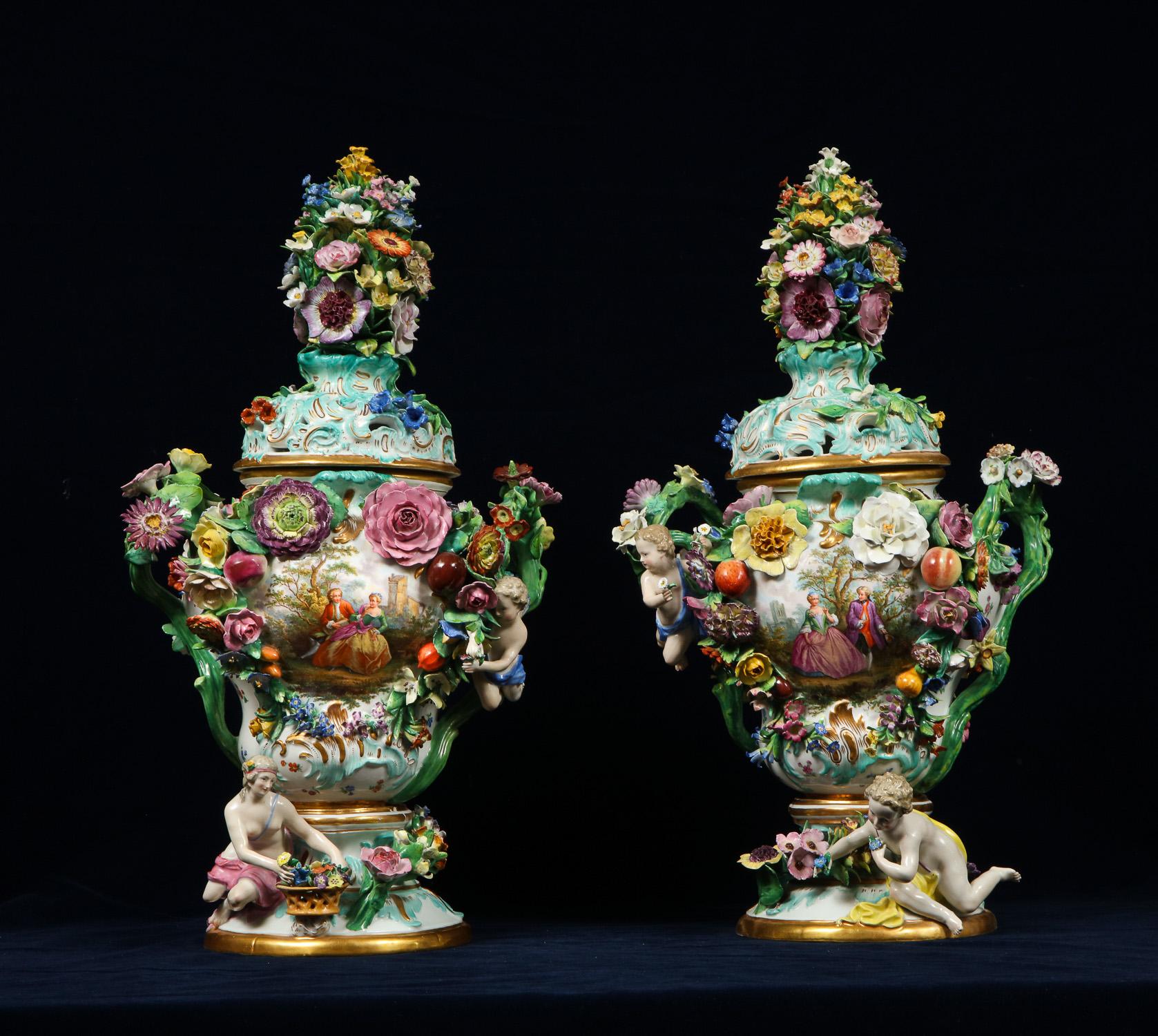 A Monumental pair of Meissen Porcelain reticulated Pot-Pourri vases and covers.
Mid-late 1800s, blue crossed swords and incised model numbers, various Pressnummern.
In the Rococo taste, each of inverted-pear form, the pierced cover surmounted by a