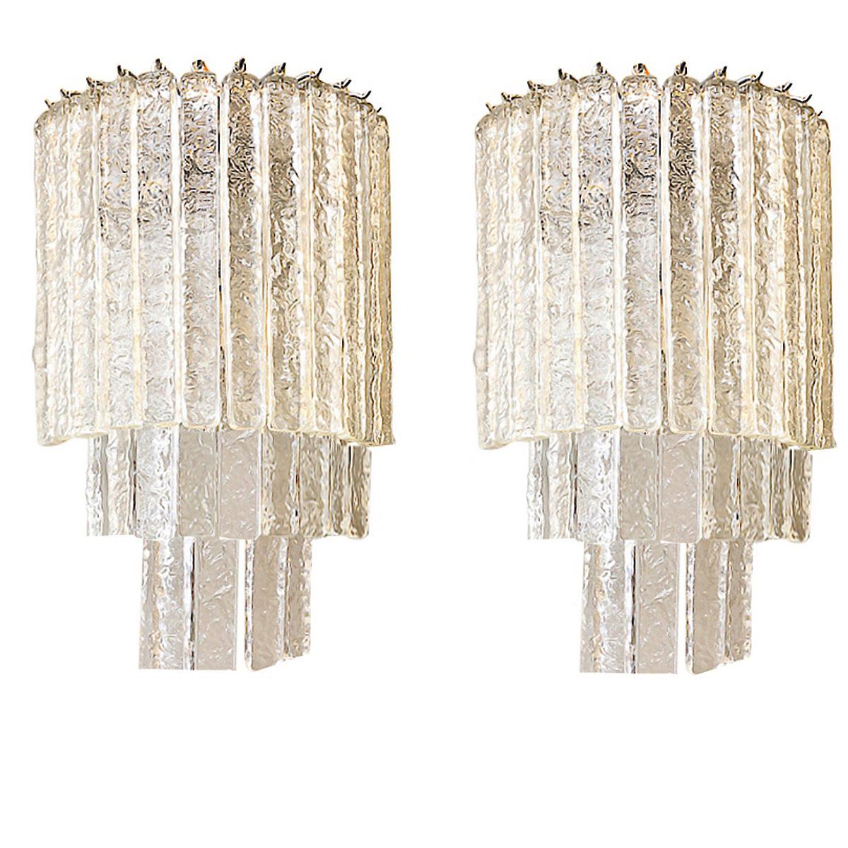 Spectacular pair of Murano glass wall sconces. The glass is designed to look like ice and they cast the most beautiful light.
Fully restored chrome frames and the glass is flawless.