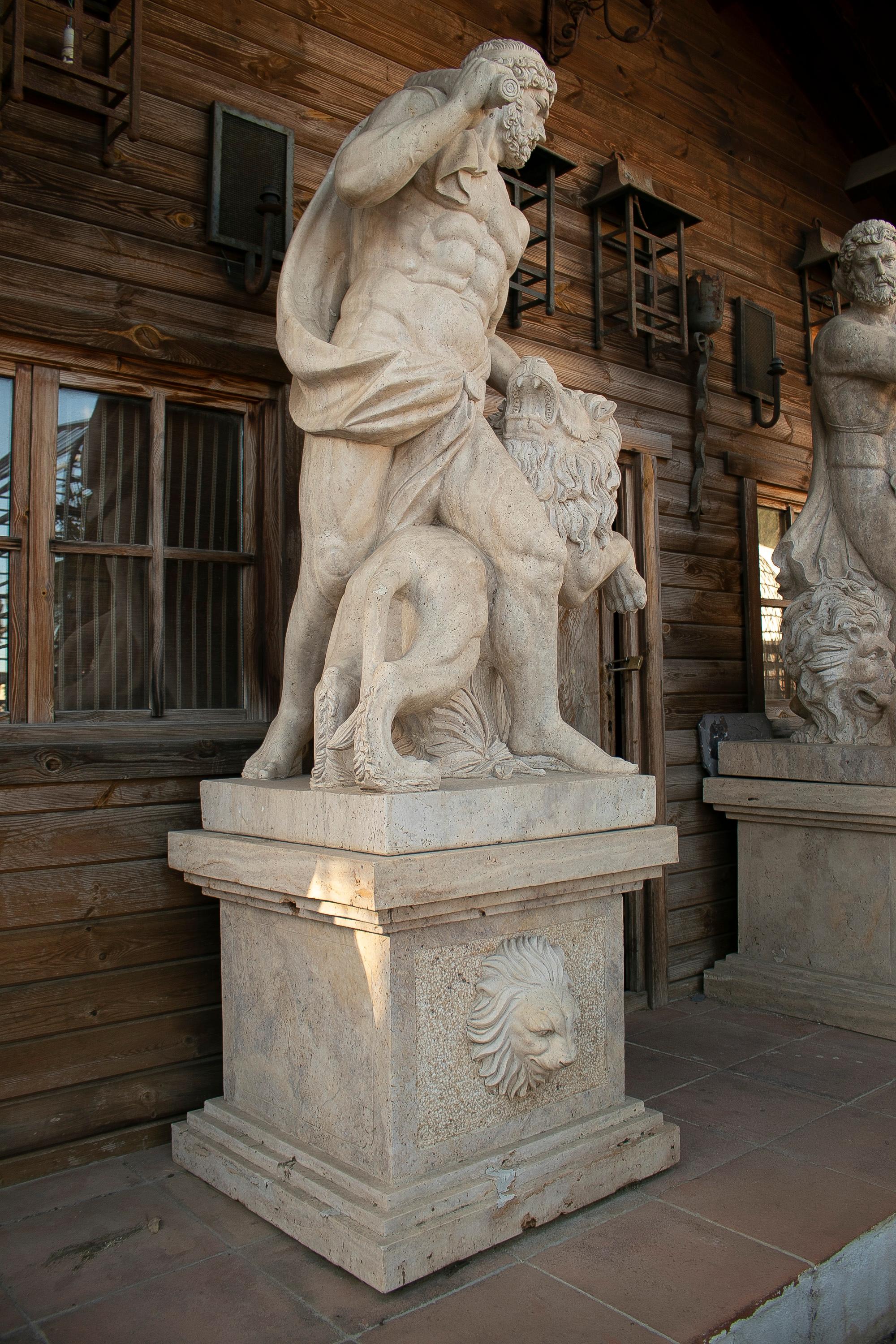 Monumental pair of Romano travertine marble Hercules tamign the lion sculptures with plilnth.
       