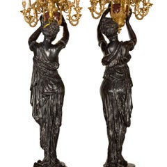 Monumental Pair of Rouge Marble, Gilt and Patinated Bronze Figural Torchères