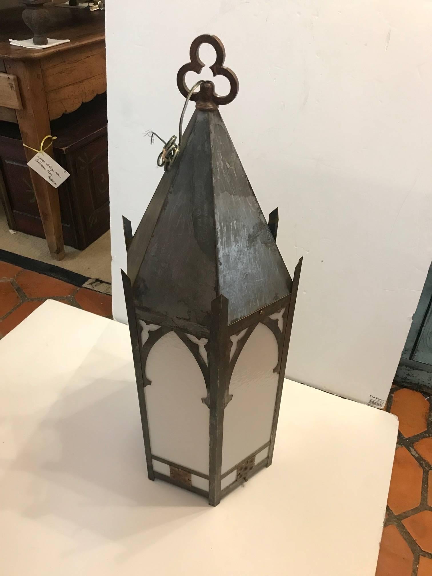 Pair of very impressive in scale, huge galvanized metal lanterns in a Gothic style, having six original glass panels, bottom and steeple top.
Bulb is changed by a side door which opens or at the bottom, single bulb inside, porcelain sockets,