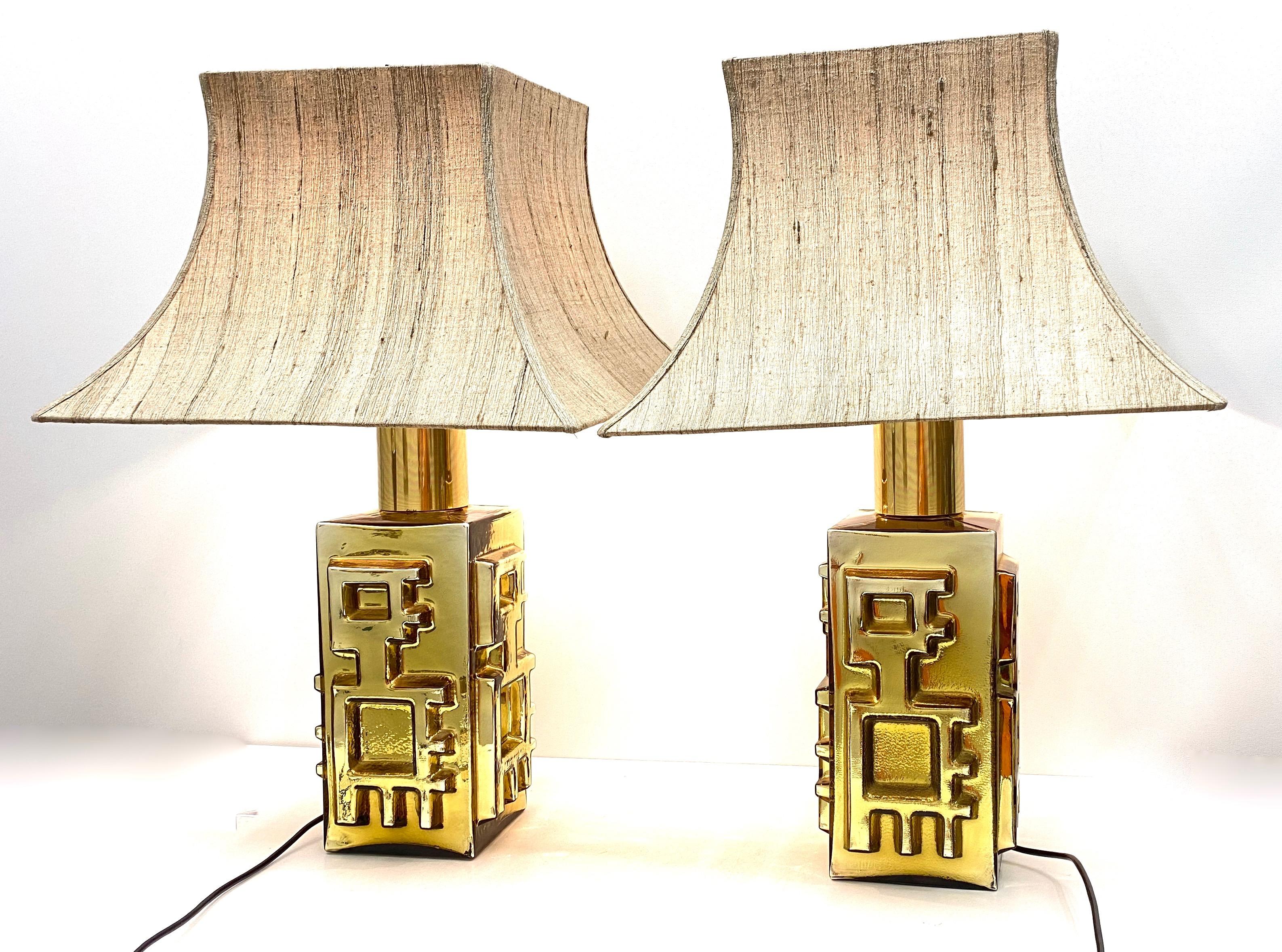 Beautiful pair of large monumental table lamps or side table lamps. Made of glass and brass, in the style of Vetro di Murano, Italy. Each light requires one European E27 / 110 Volt Edison bulb, up to 60 watts. They come without the original shades,