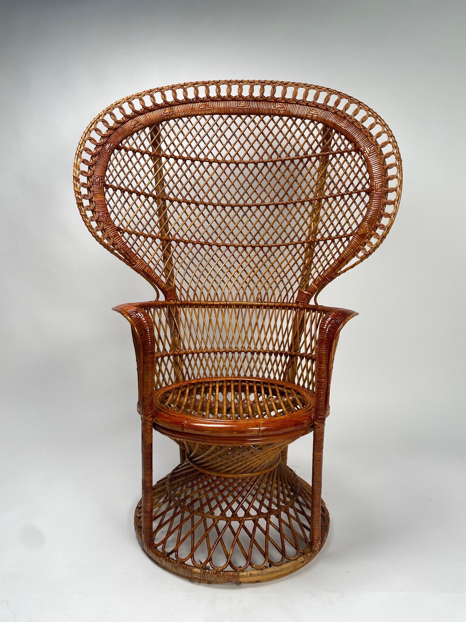 Monumental Pair of Pavone wicker armchairs, Italy, 1970s

It is one of the most iconic models among designer wicker armchairs. It reproduces the shapes of a large peacock, hence the name 