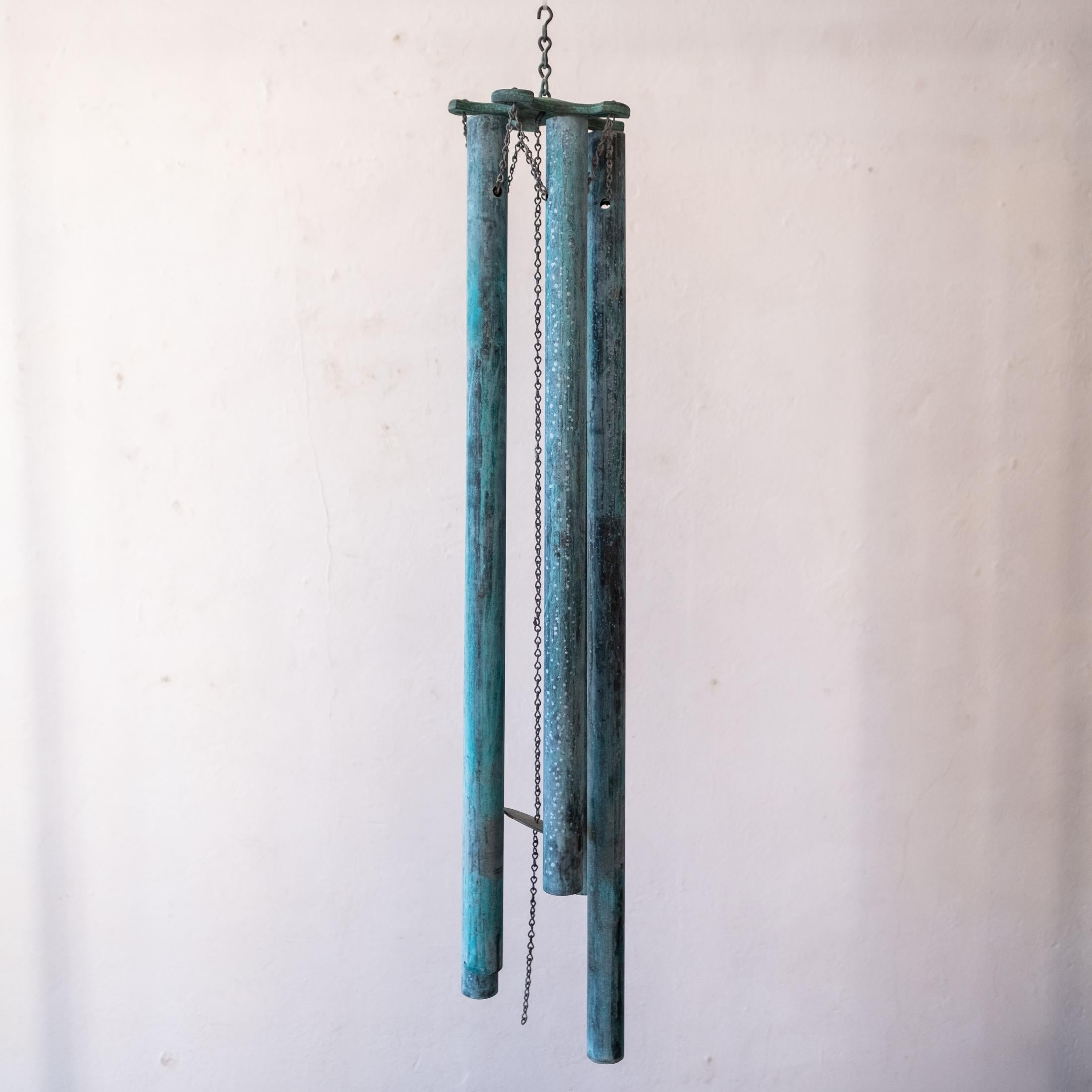 A set of extra large patinated bronze wind chimes. 36