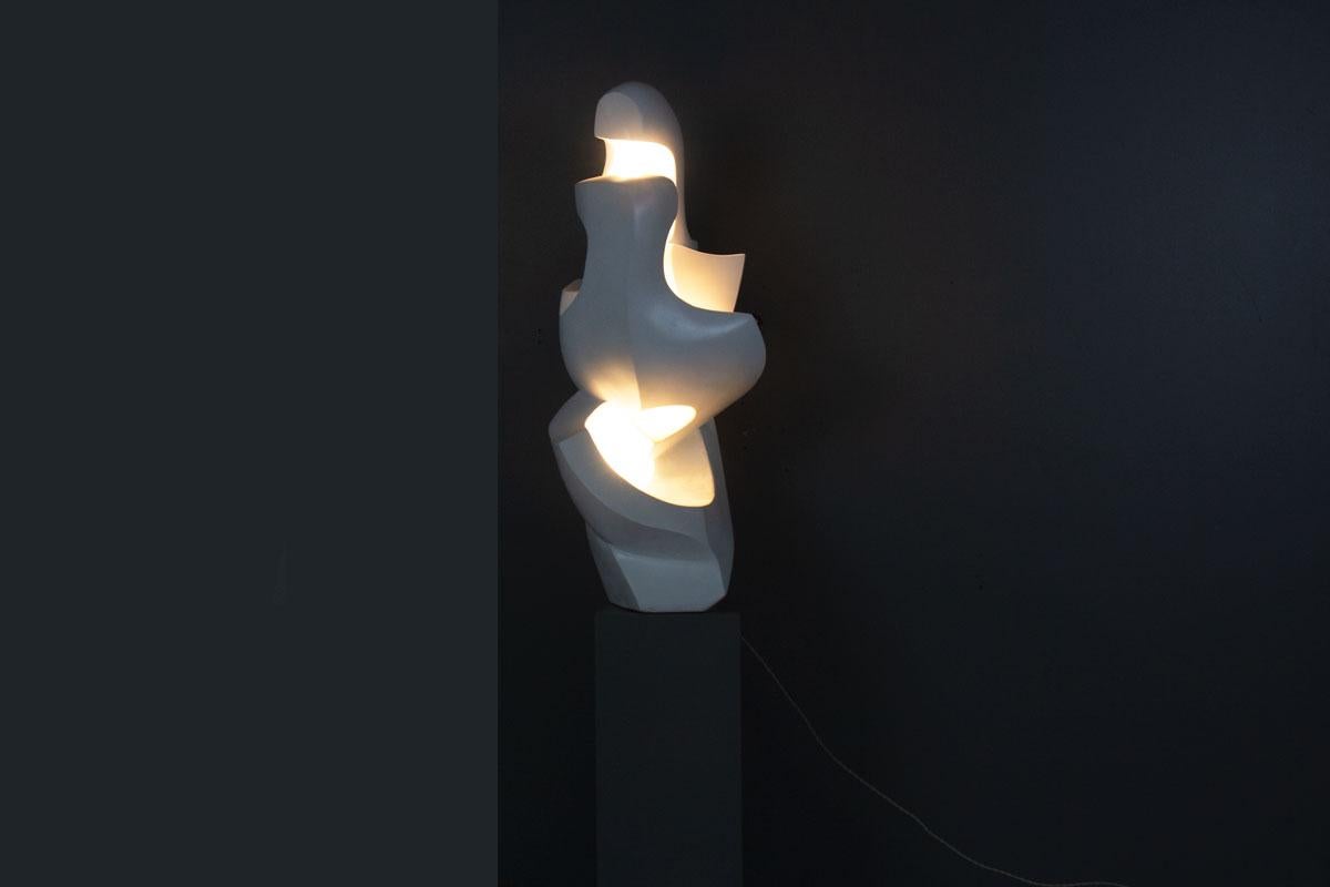 Elevate your interior with this rare and striking plaster sculpture by artist M. Reollon, signed and dated 1981. Standing an impressive 108 cm tall, this one-of-a-kind piece seamlessly merges sculptural artistry with functional design through its
