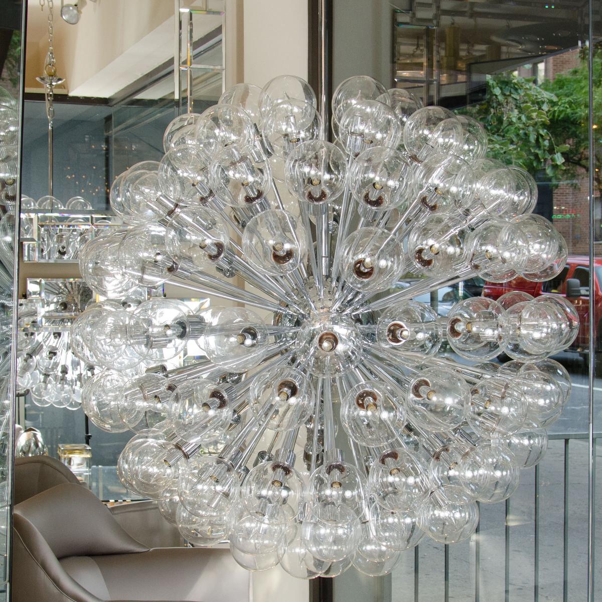 Monumental polished chrome Sputnik chandelier featuring spherical clear glass shades by Motoko Ishii for Staff Leuchten.