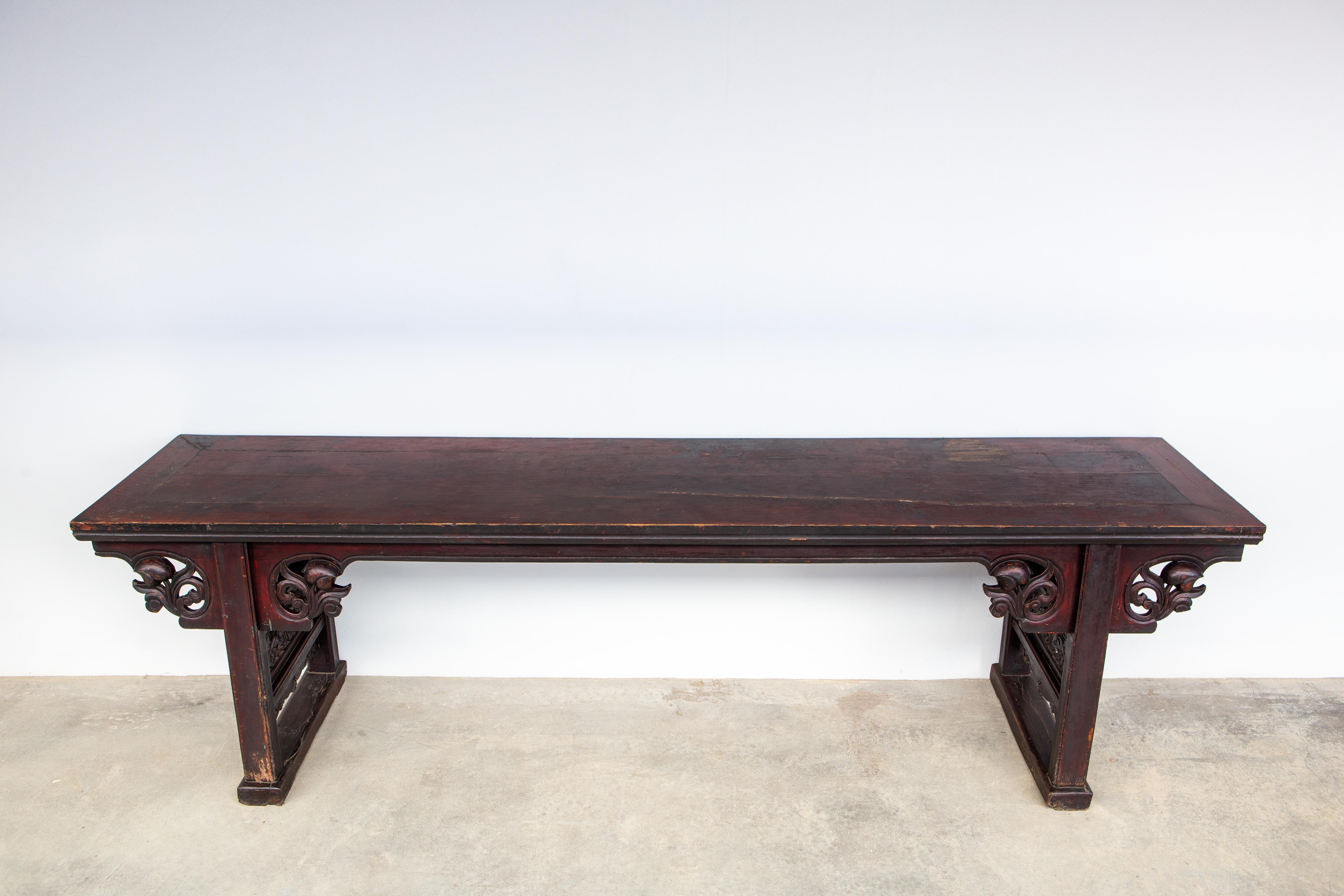 This monumental altar table is from Shanxi Province, China and was made from Elm wood during the mid-Qing dynasty. The piece retains most of its original oxblood lacquer. Oxblood is one of the three traditional Chinese lacquers. Red and black
