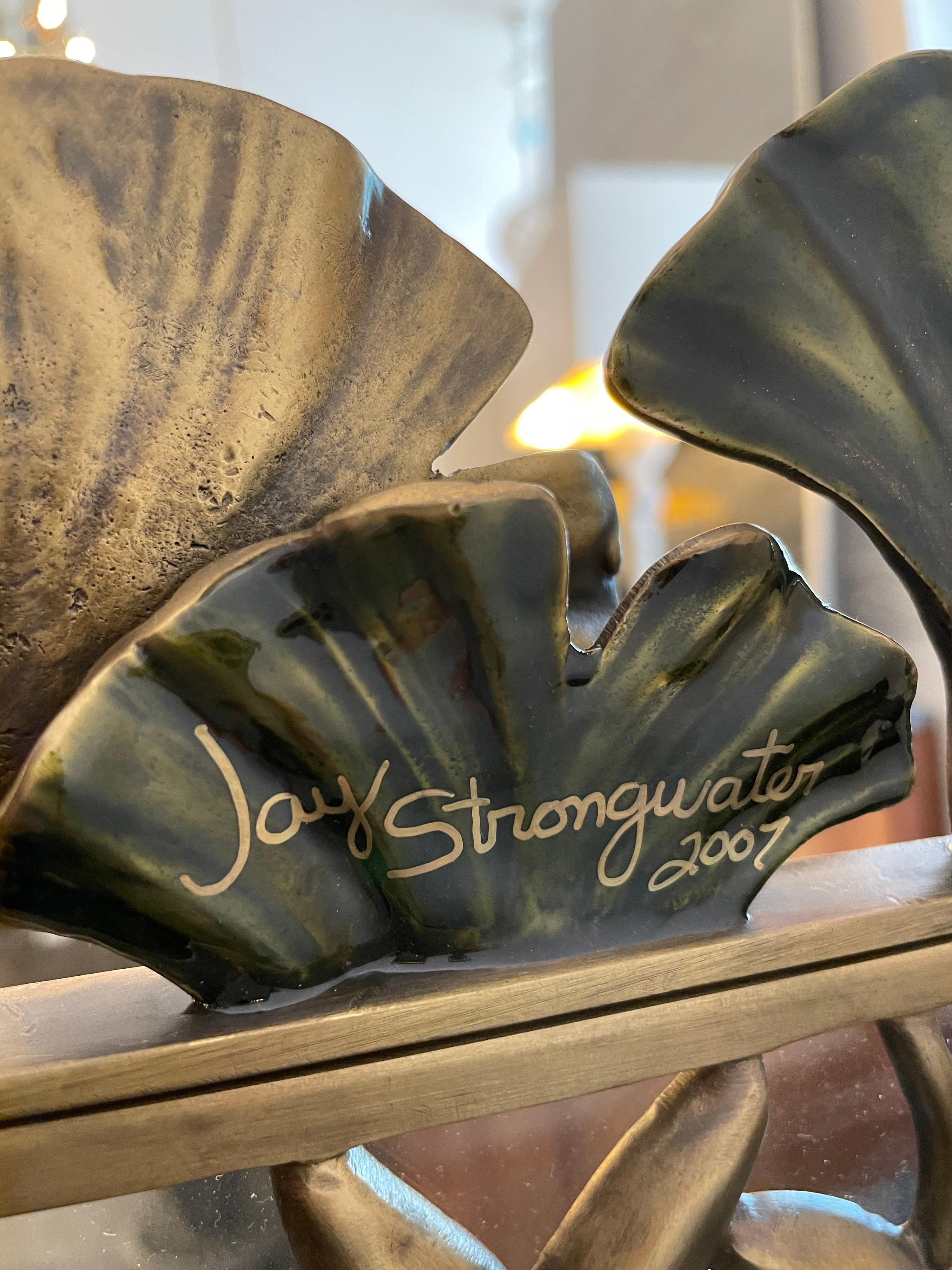 Jay Strongwater Signed Gingko leaves green gold frame. This authentic Jay Strongwater Gingko Leaf Frame is a stunning design. The back and trim is done in an antique gold-brass tone. Easel back frame. Measures 16