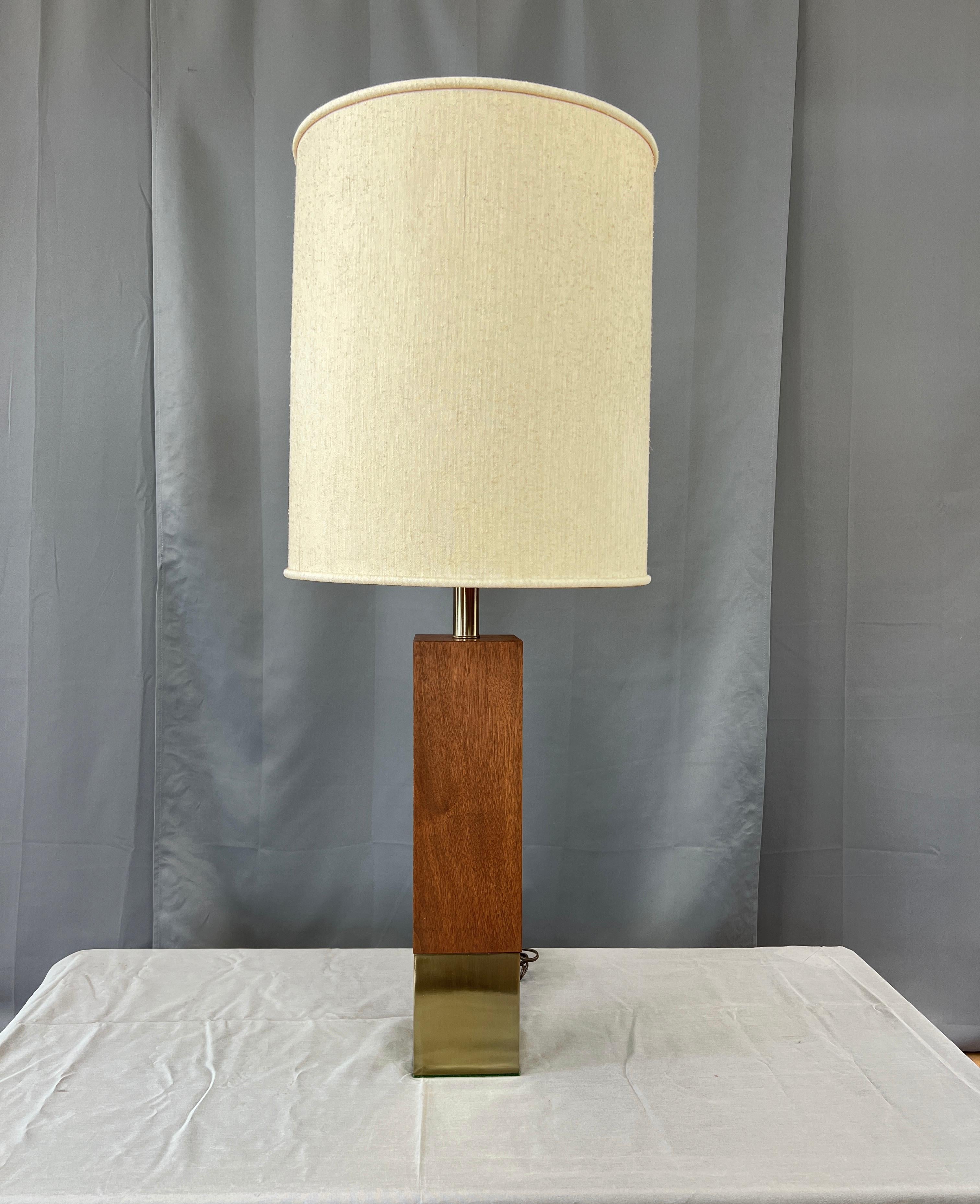 A monumental table lamp in walnut and brass color by Laurel Lamp Co. 
This large lamp starts with a colored brass metal base then continues with beautiful Walnut.
Has a long cord, and a newer light socket.

Measurements below are to the socket,