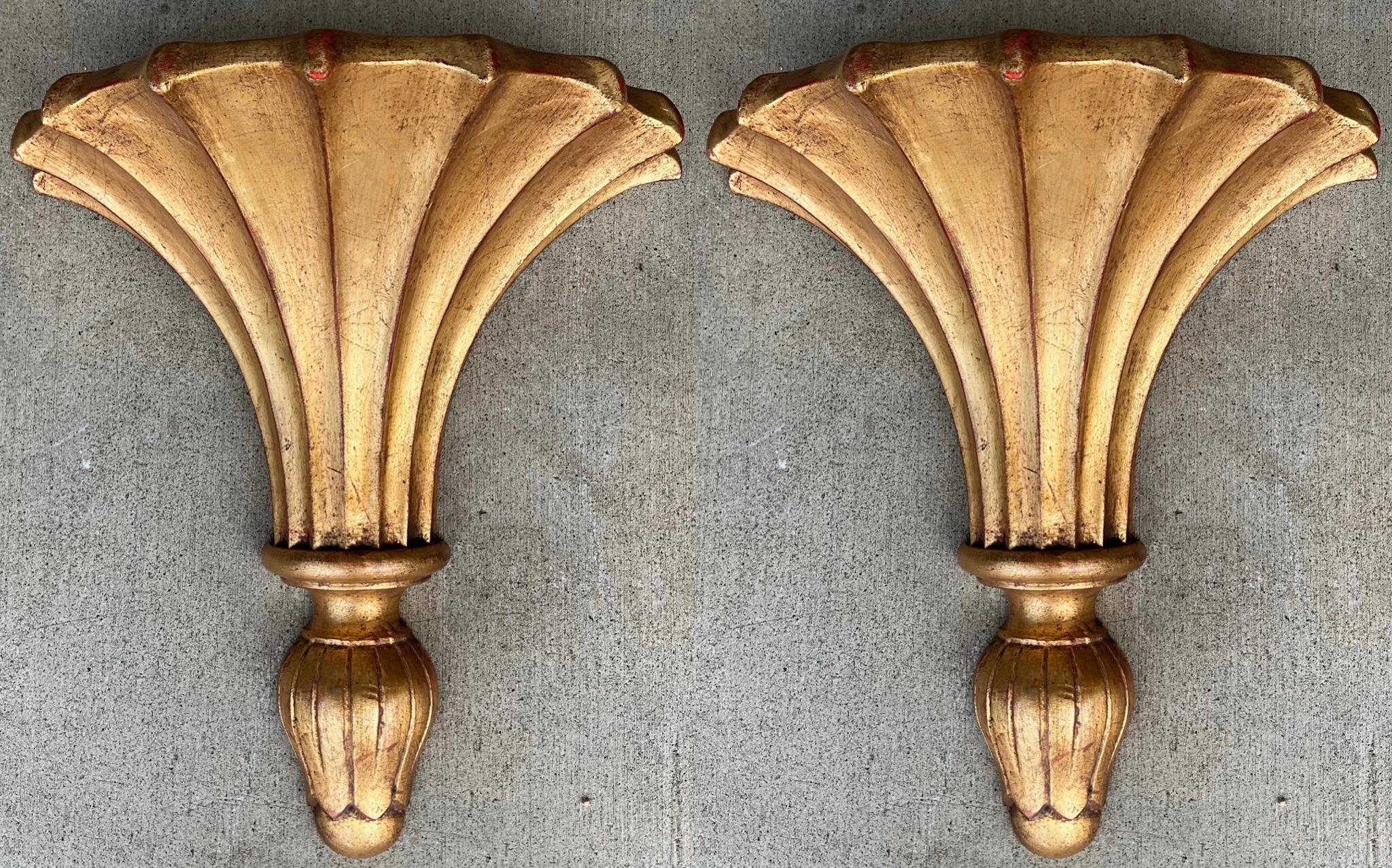 These are a fabulous Size! It is a pair of monumental Italian carved giltwood wall brackets with Regency styling. They most likely date to the middle of the 20th century, and they are unmarked.
