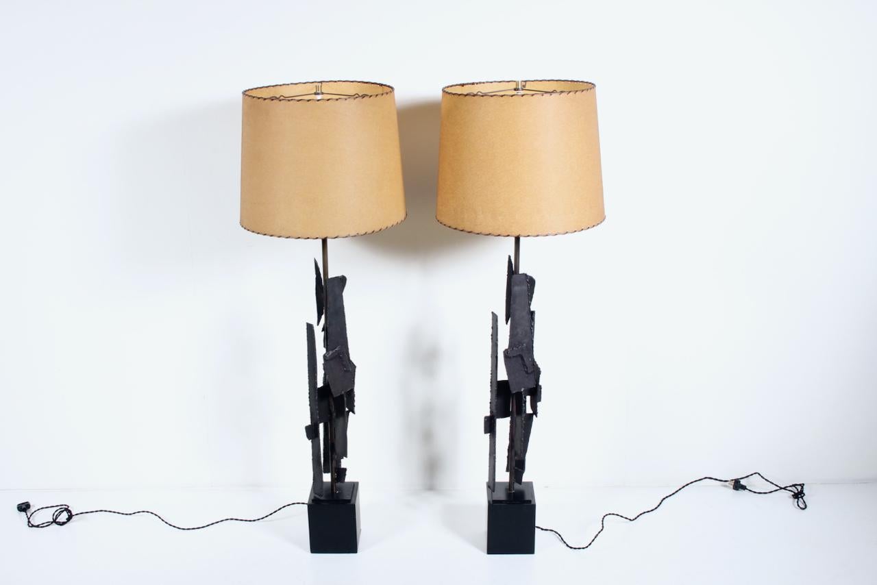 Substantial original pair H-734 Richard Barr for Laurel Lamps Co. table lamps. Featuring sturdy four foot high welded torch cut patinated Iron forms atop Black enameled 5