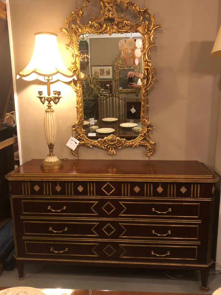A beautiful and palatial Russian step up neoclassical style, four by four drawer chest or commode in the Louis XVI fashion. Monumental in size sitting over five feet wide, polished and restored. This one of a kind extra large chest or dresser