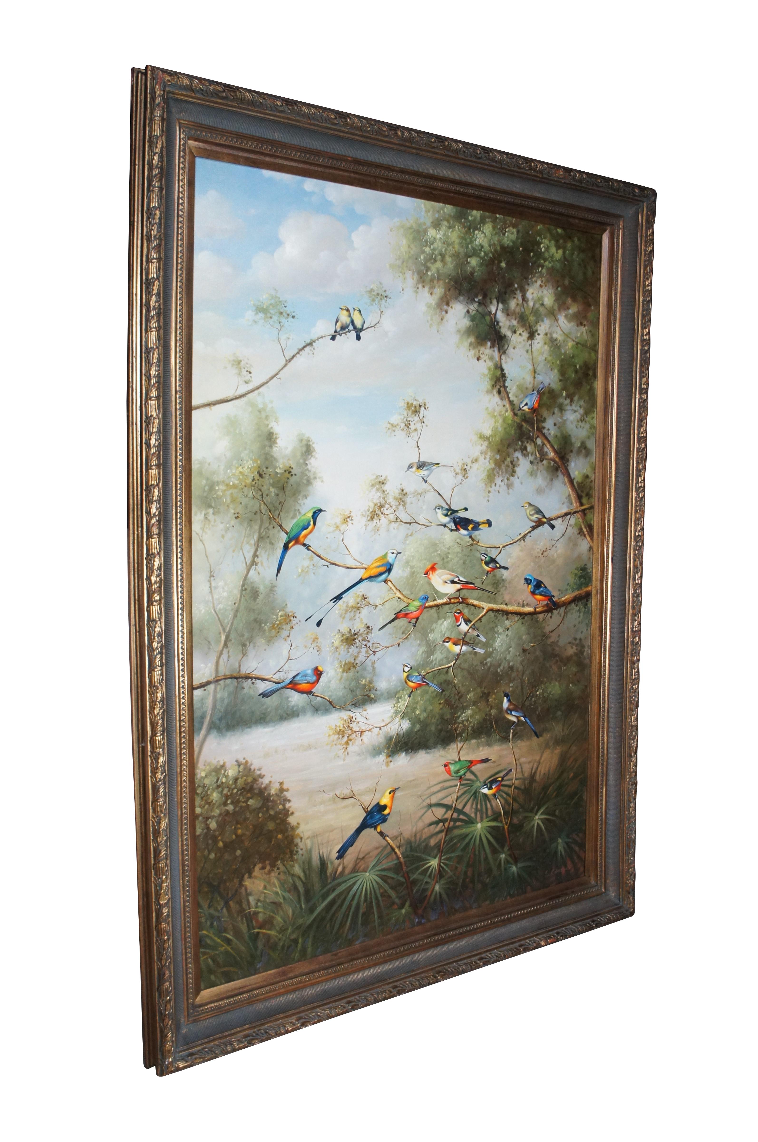 A large and impressive oil painting showcasing tropical birds perched on trees in a woodland setting lakeside.  The painting is signed lower left by S. Robertson and ornately framed in gold with neoclassical designs.  The beautiful painting is