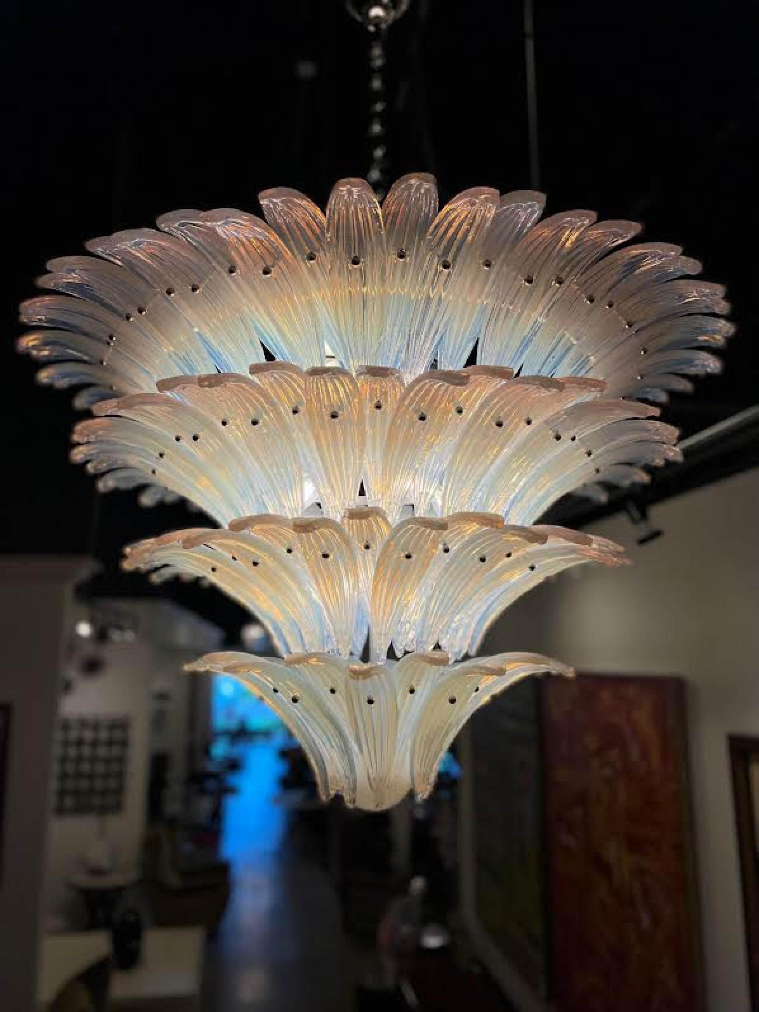 French Art Deco clear molded Opalescent glass chandeliers with a 4-tier flaired design and having leaf form panels and a ball finial bottom (SABINO)