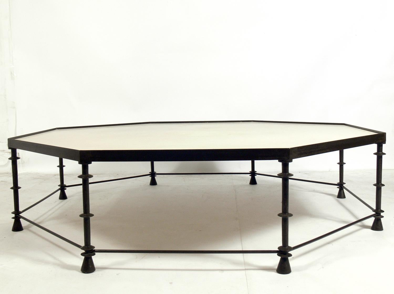 Monumental scale coffee table, in the style of Diego Giacometti, circa 1990s. This piece was custom made and is constructed of a bronze color finished metal with an inset ivory color travertine top. It measures an impressive 5 foot diameter.
