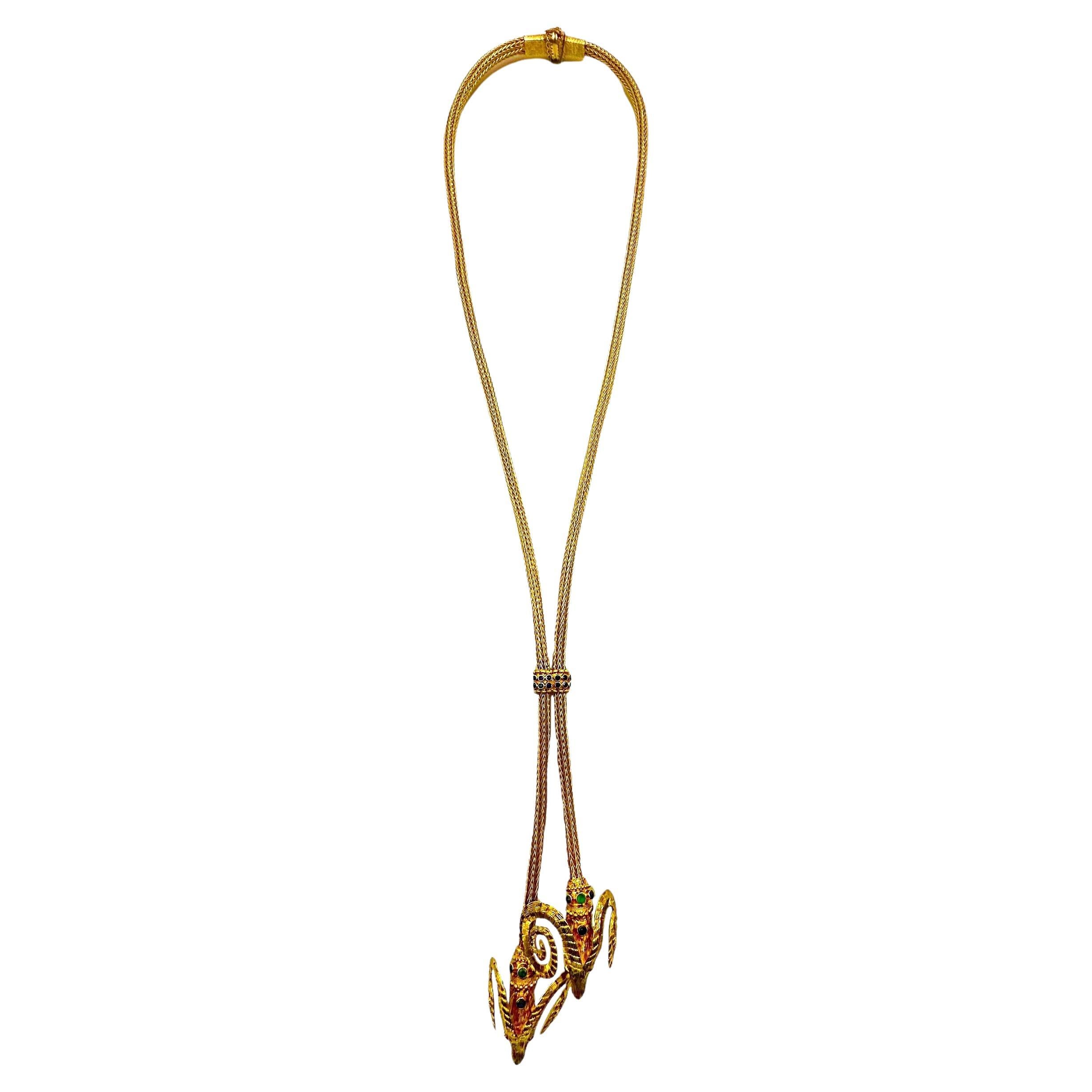 This 18k yellow gold Lalaounis double rams head lariat necklace is a truly magnificent example of  the esteemed Greek designers offerings. From clasp to tip, the necklace is comprised of 6mm diameter braided round gold strands, terminating at the
