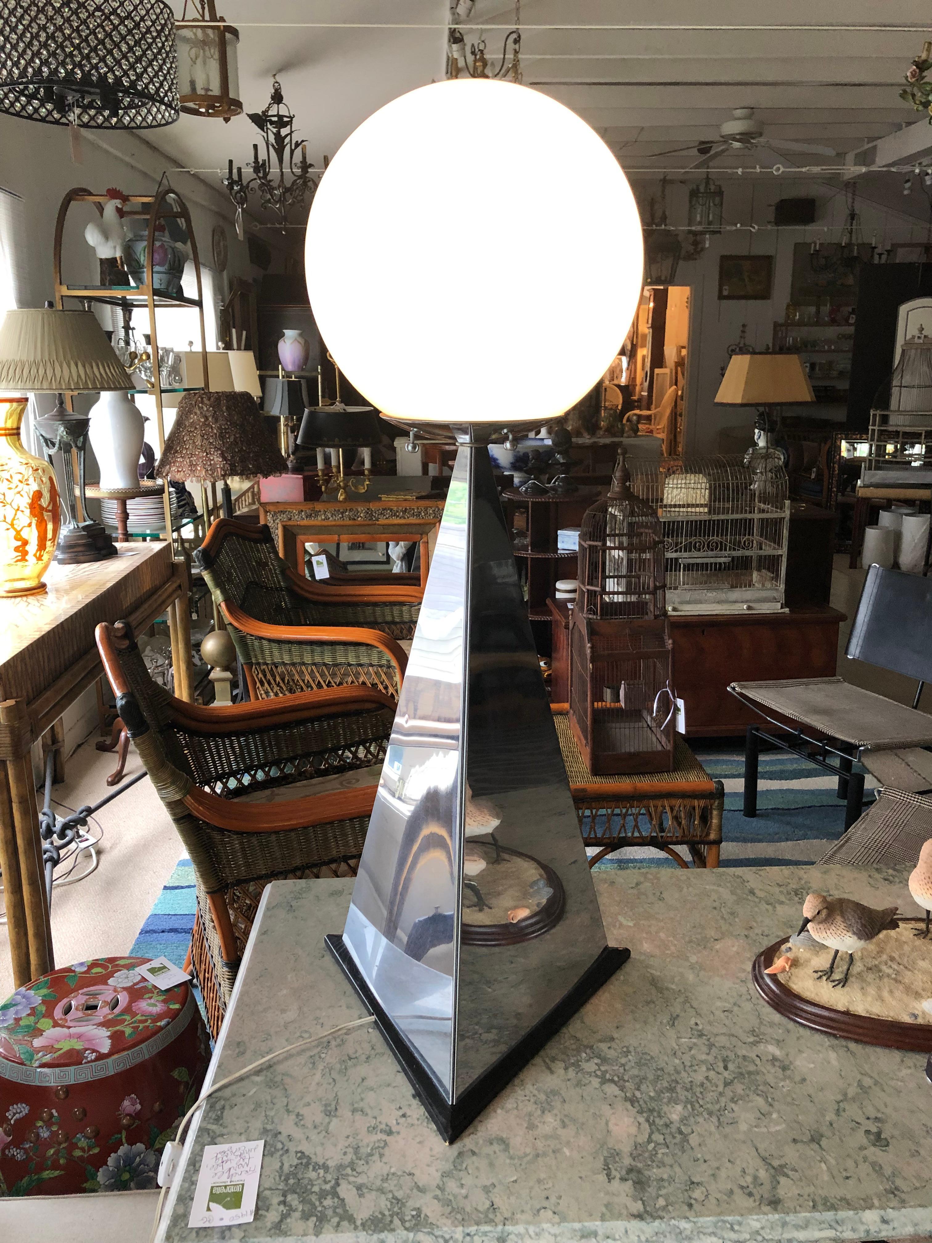Monumental statement lamp having mirrored triangular obelisk signed C Jere on the bottom. The lamp is triangular in form with a large glass ball globe top, circa 1970s Art Deco Revival glam disco style. Accepts standard size screw in bulb. Base is