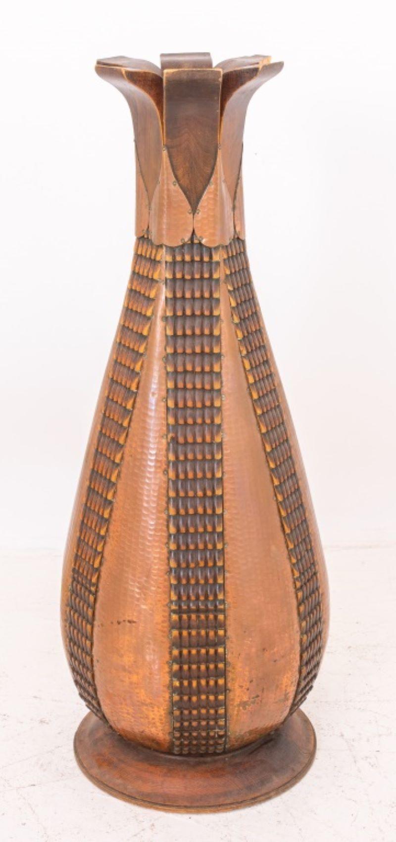 Monumental Secessionist Jugendstil carved wood vase with applied hammered brass decor.

Dealer: S138XX.