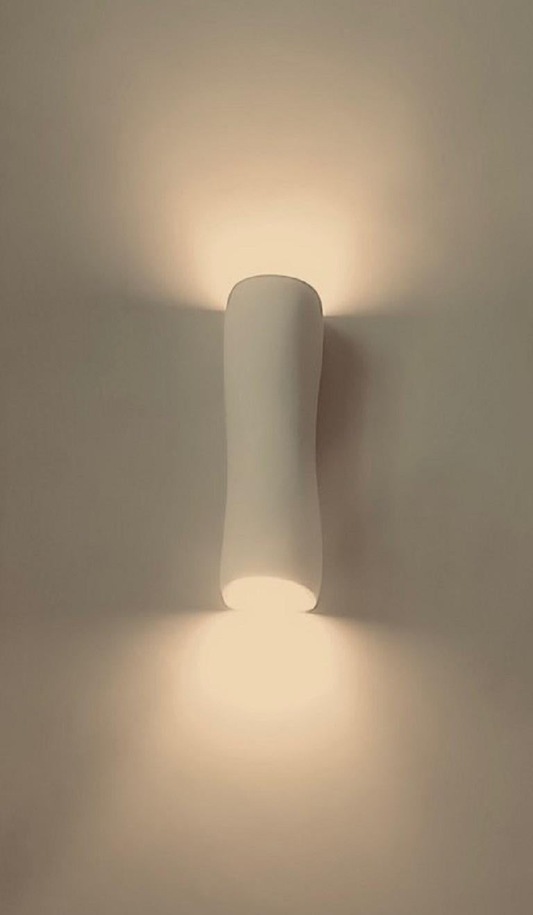 Handmade “Monumental Serenity” organic modern wall light/wall sconce, in silky smooth white plaster, created by artist Hannah Woodhouse in her London studio. Contemporary organic modern design inspired by nature and mid-century European sculpture.