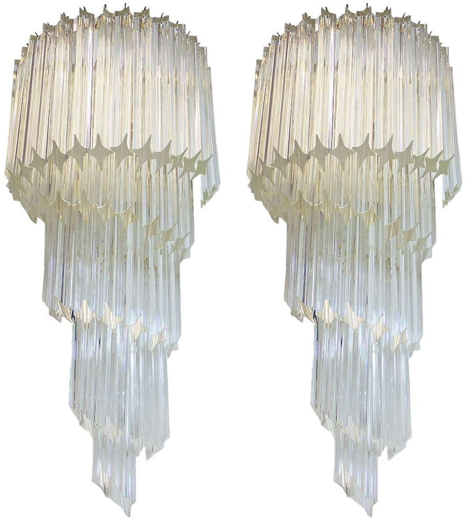 Set of four monumental clear crystal sconces, Italy, 1970s. Price is for a set of four.
There are 3 pairs available in total.
A single pair can be purchased.
These are made to impress and that they do.

These are located in our warehouse in