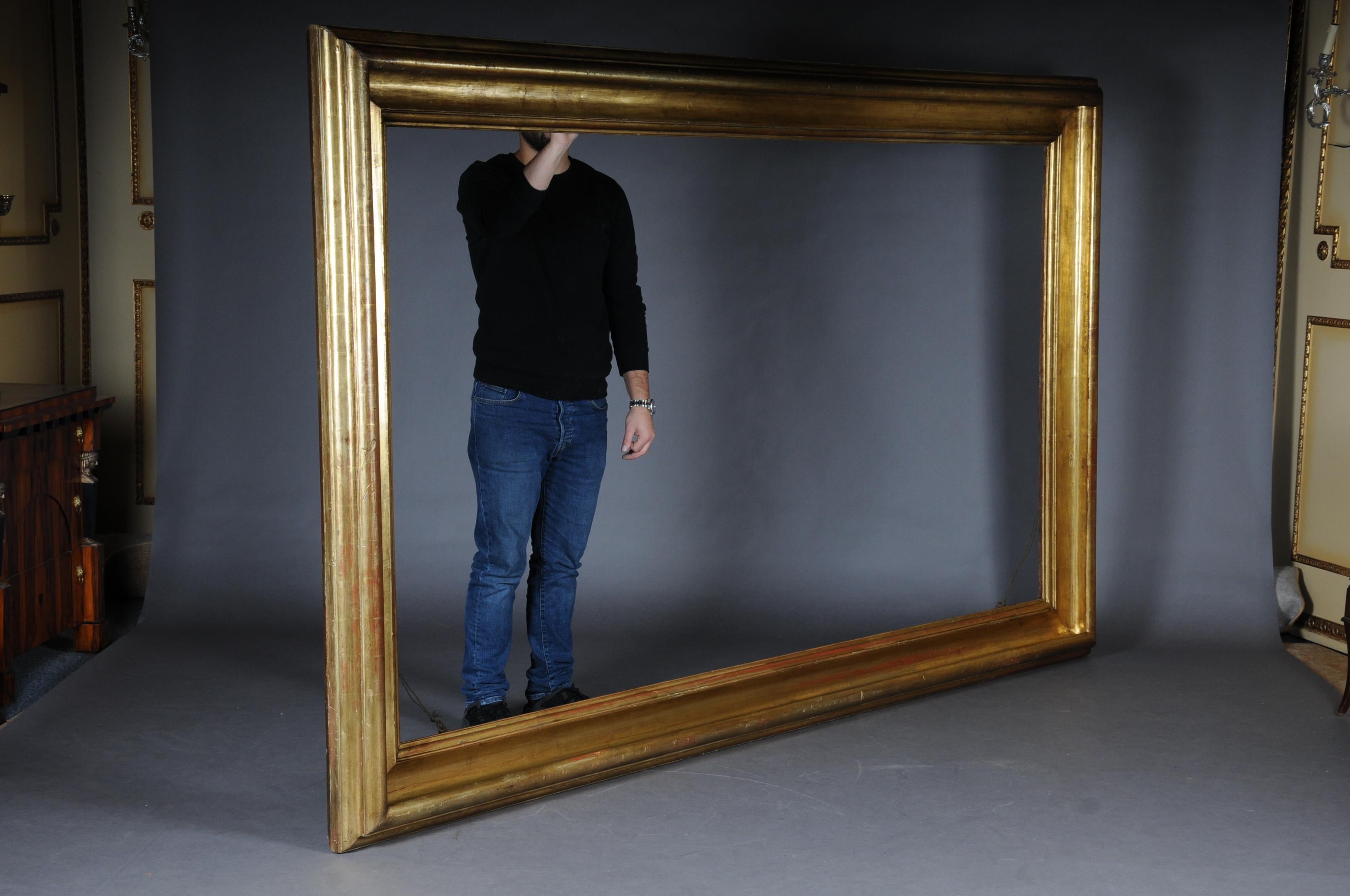 Monumental sheet gilded mirror frame / picture frame, circa 1850.

Multi-level profiled frame in solid wood and genuine gold leaf.
 
(M-40).