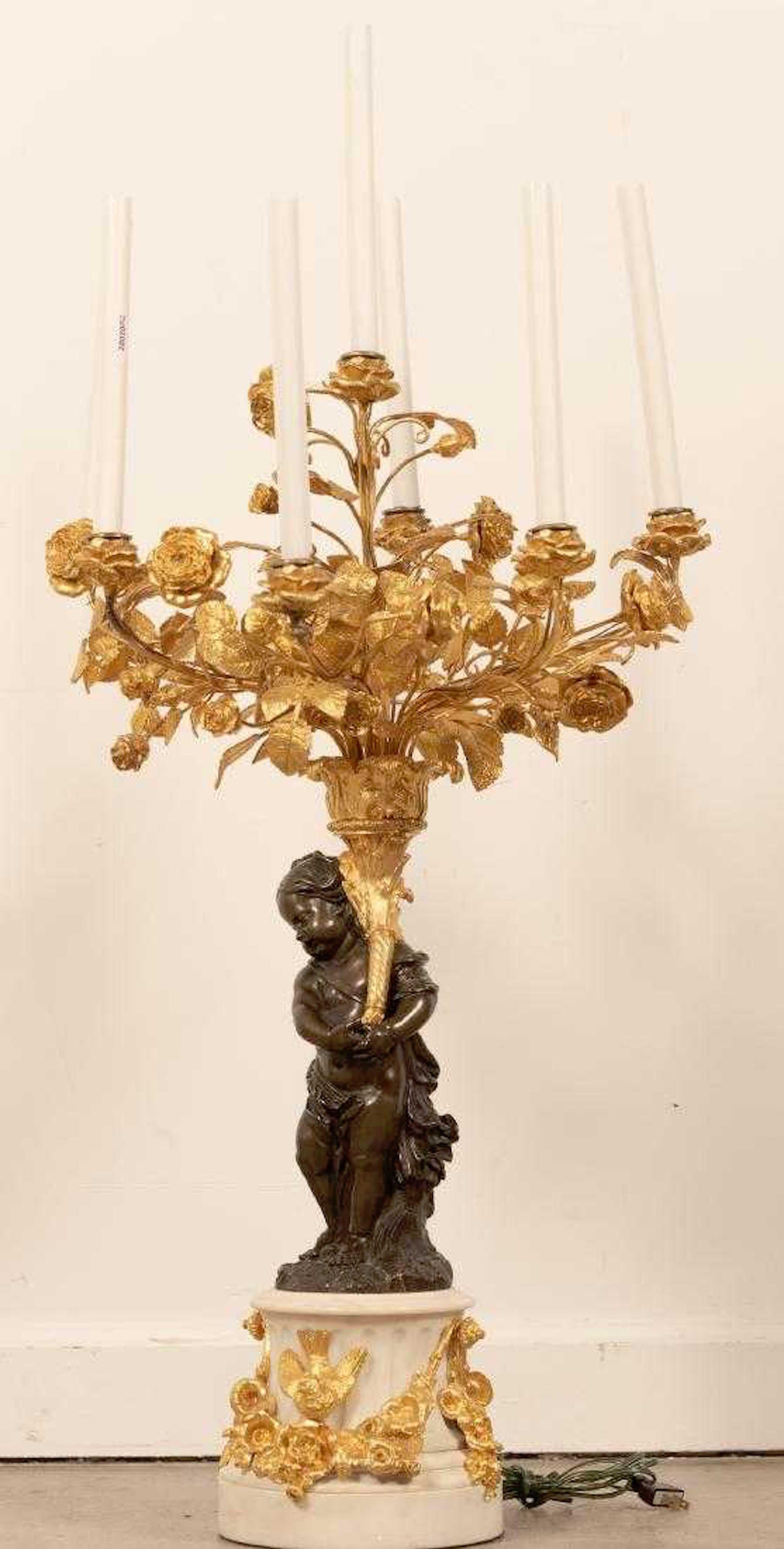 Monumental Single Louis XVI Style Ormolu and Patinated Seven-Light Candelabra

Illuminate your space with the traditional allure of this monumental single Louis XVI style ormolu and patinated seven-light candelabra. Originating from France in the