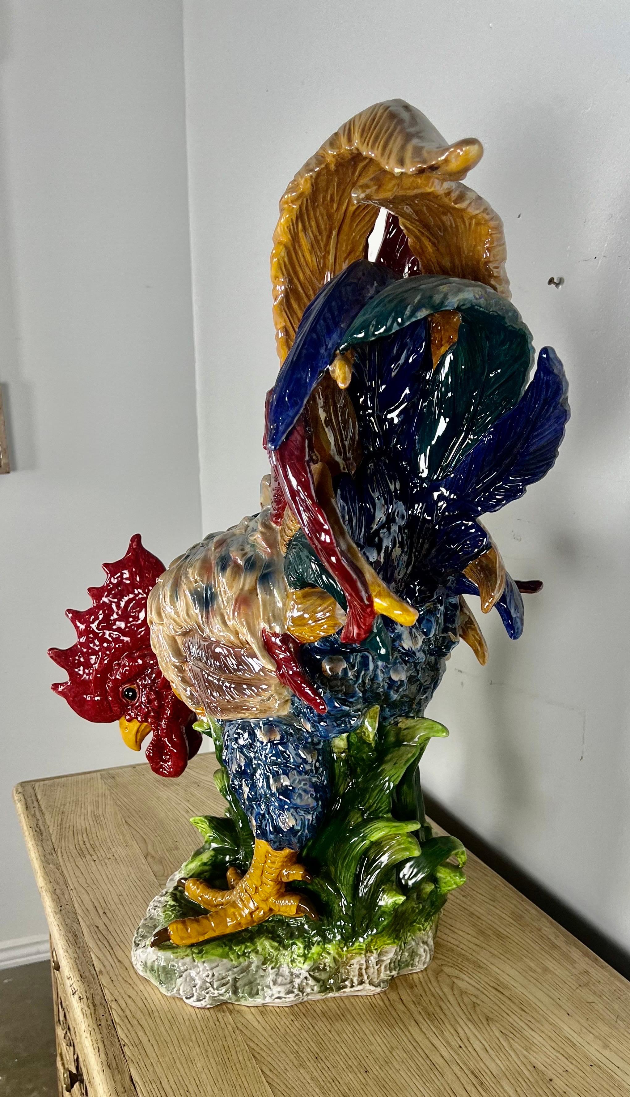 Monumental size glazed porcelain Majolica style chicken in vibrant shades of red, blue, green & gold with some brown accents.  Excellent condition.