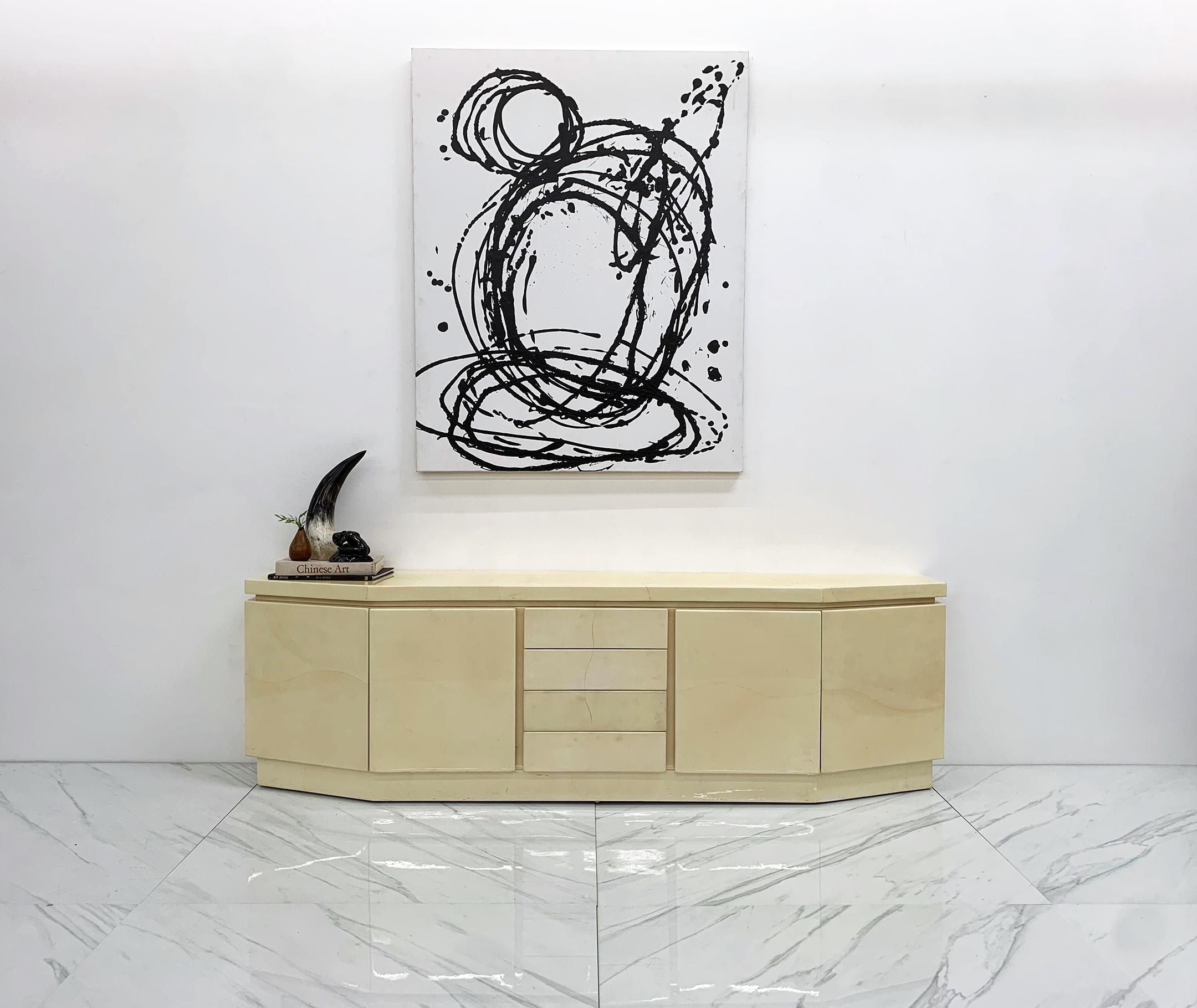 This piece is absolutely stunning!! A monumentally large Karl Springer custom angular credenza in a creamy, ultra luxurious goatskin. The goat skin hides on the front have a wonderfully matched curvy seem that is just stunning. This dreamy credenza