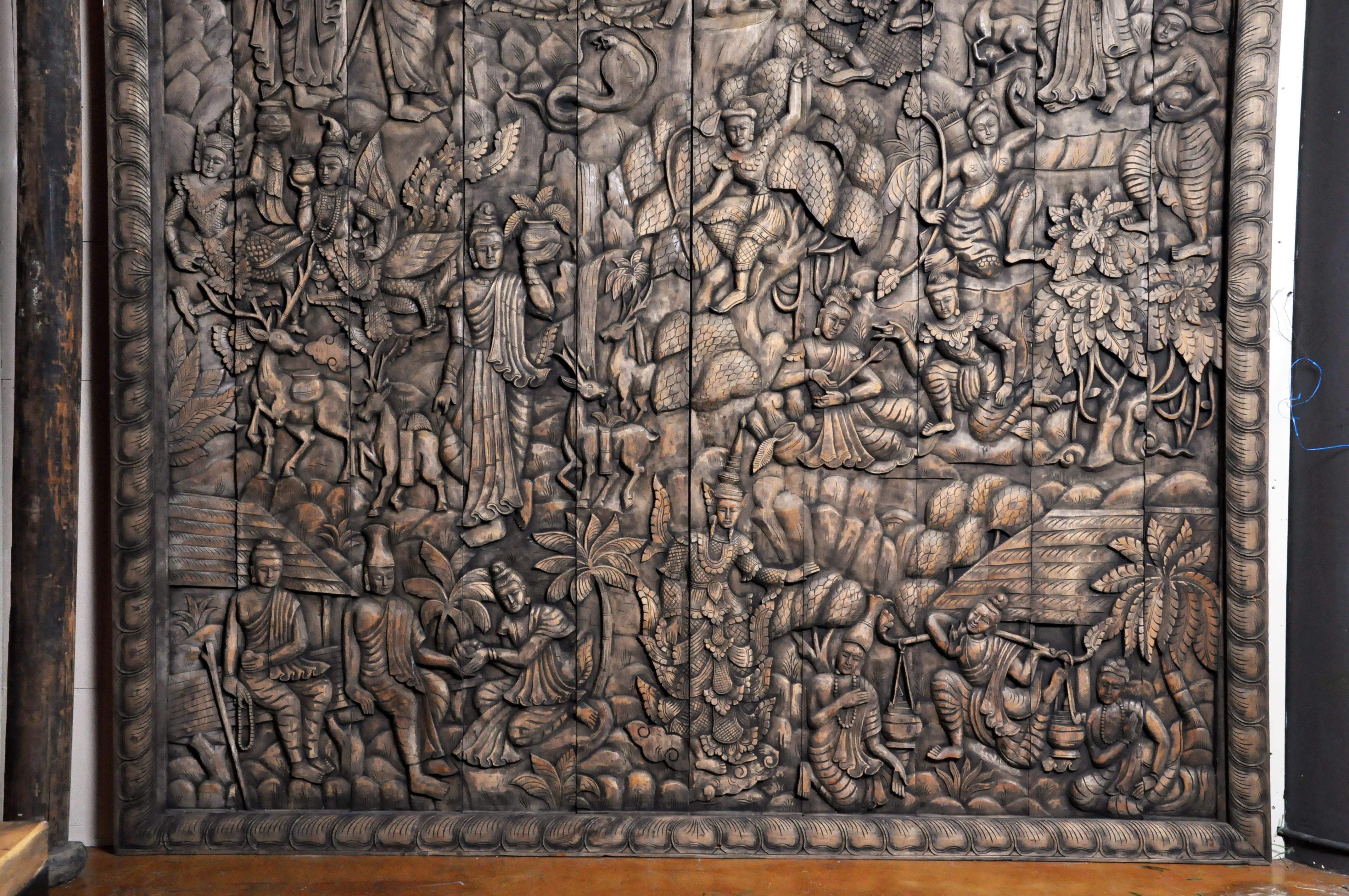 This newly hand carved wall panel features a relief design representing the life and story of Buddha. It includes the Thai angles (also known as deva, thep, thewa or thewada), titans and other mythical figures (Asuras, Pretas, Narakas), a stag