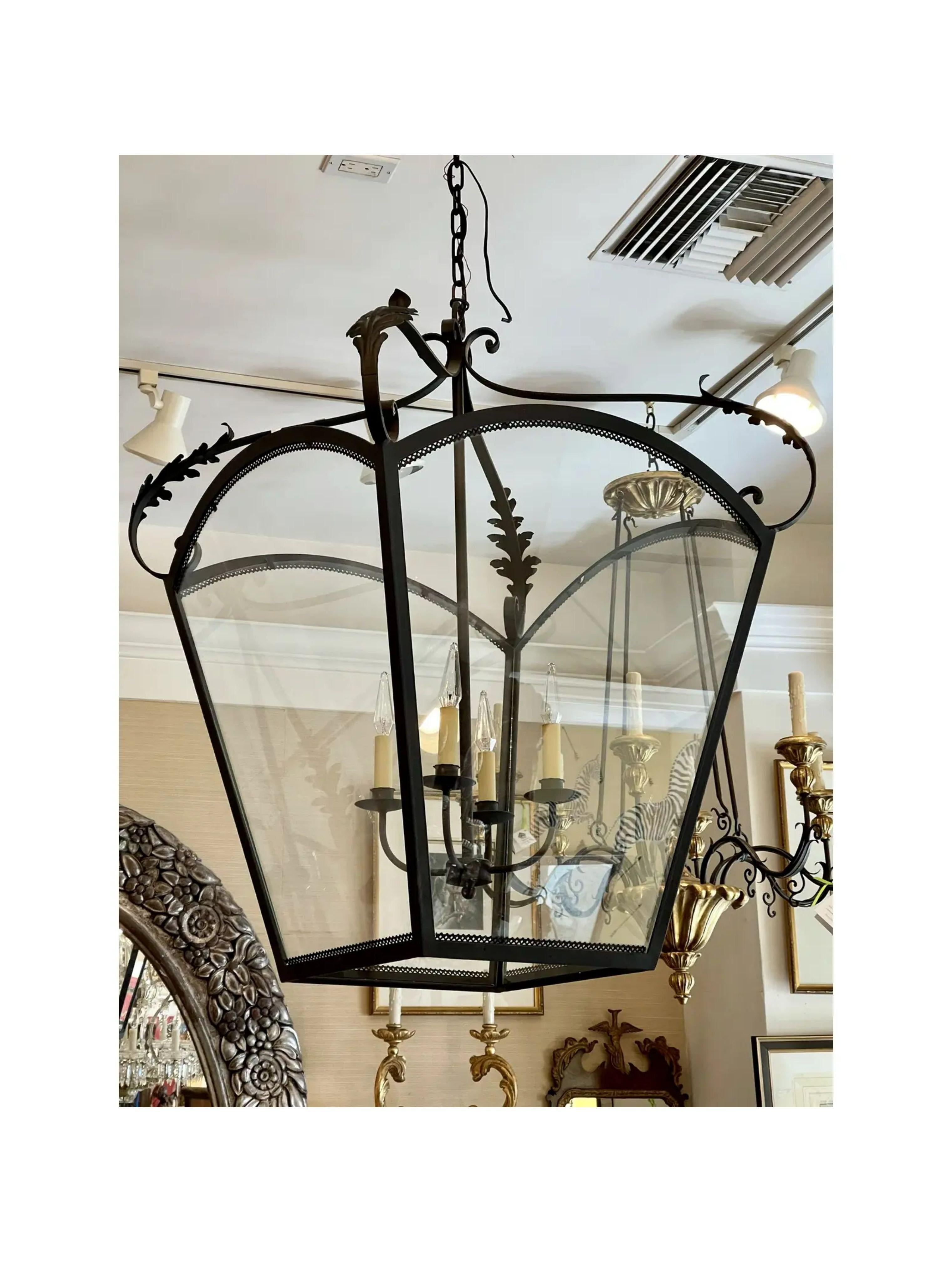 Huge Spanish Colonial wrought iron lantern chandelier

Additional information: 
Materials: Giltwood, Mahogany, Wrought Iron
Please note that this item contains materials that are legally subject to a special export process that may extend the