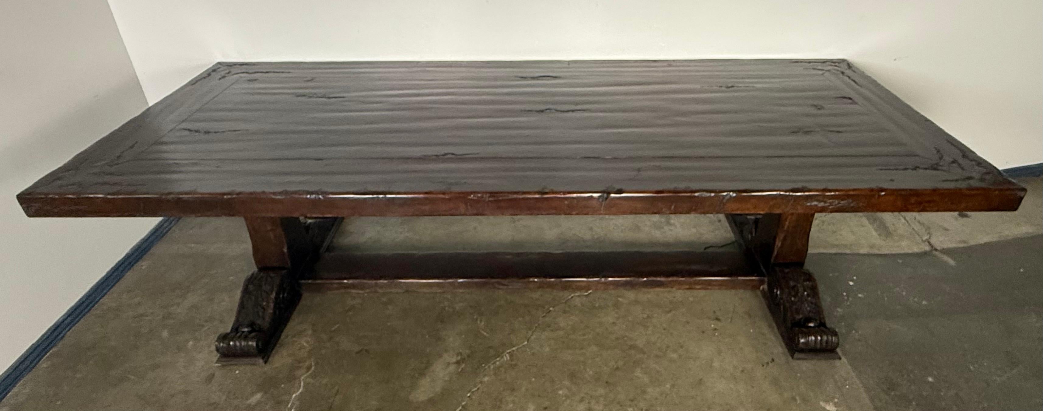Spanish Colonial Monumental Spanish Revival Carved Trestle Dining Table, Early 20th Century For Sale
