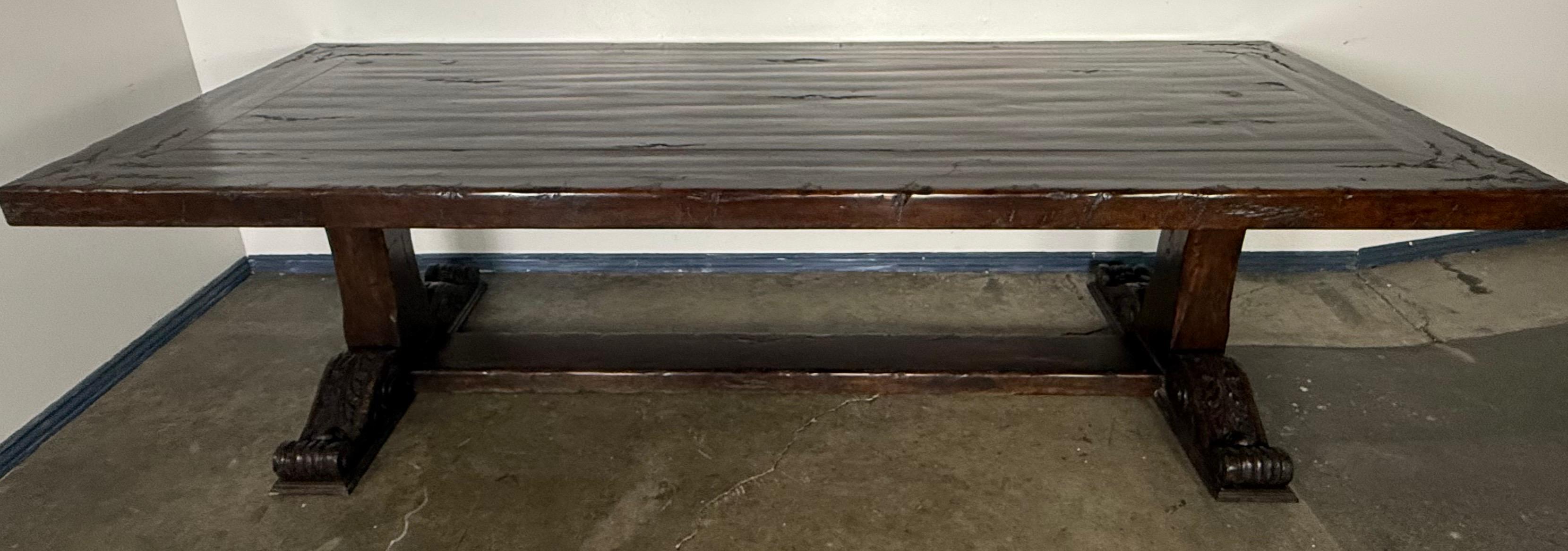 Monumental Spanish Revival Carved Trestle Dining Table, Early 20th Century In Good Condition For Sale In Los Angeles, CA