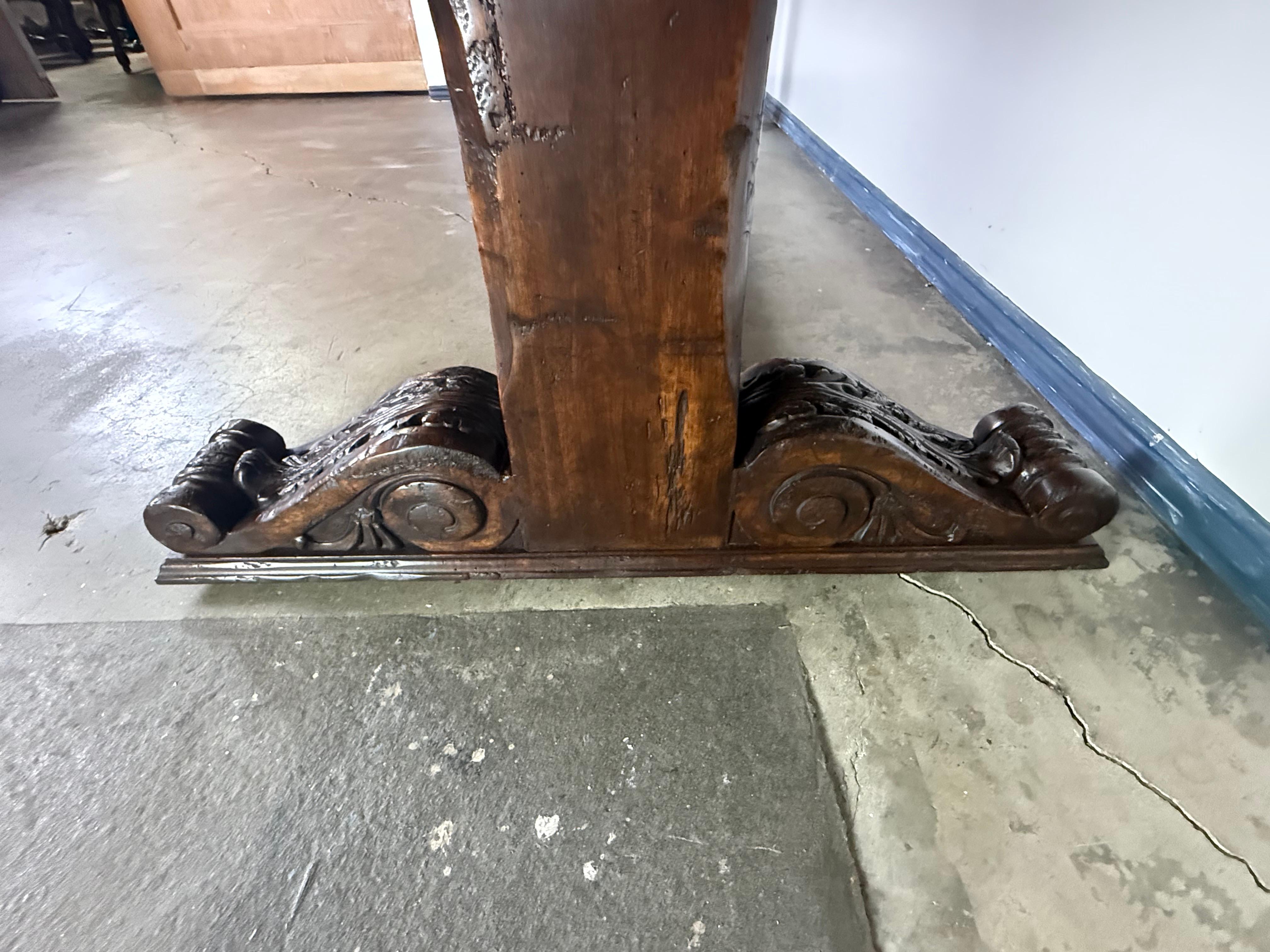 Walnut Monumental Spanish Revival Carved Trestle Dining Table, Early 20th Century For Sale