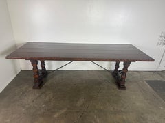 Monumental Spanish Revival Style Walnut Trestle Dining Table with Hand-Hewn Top