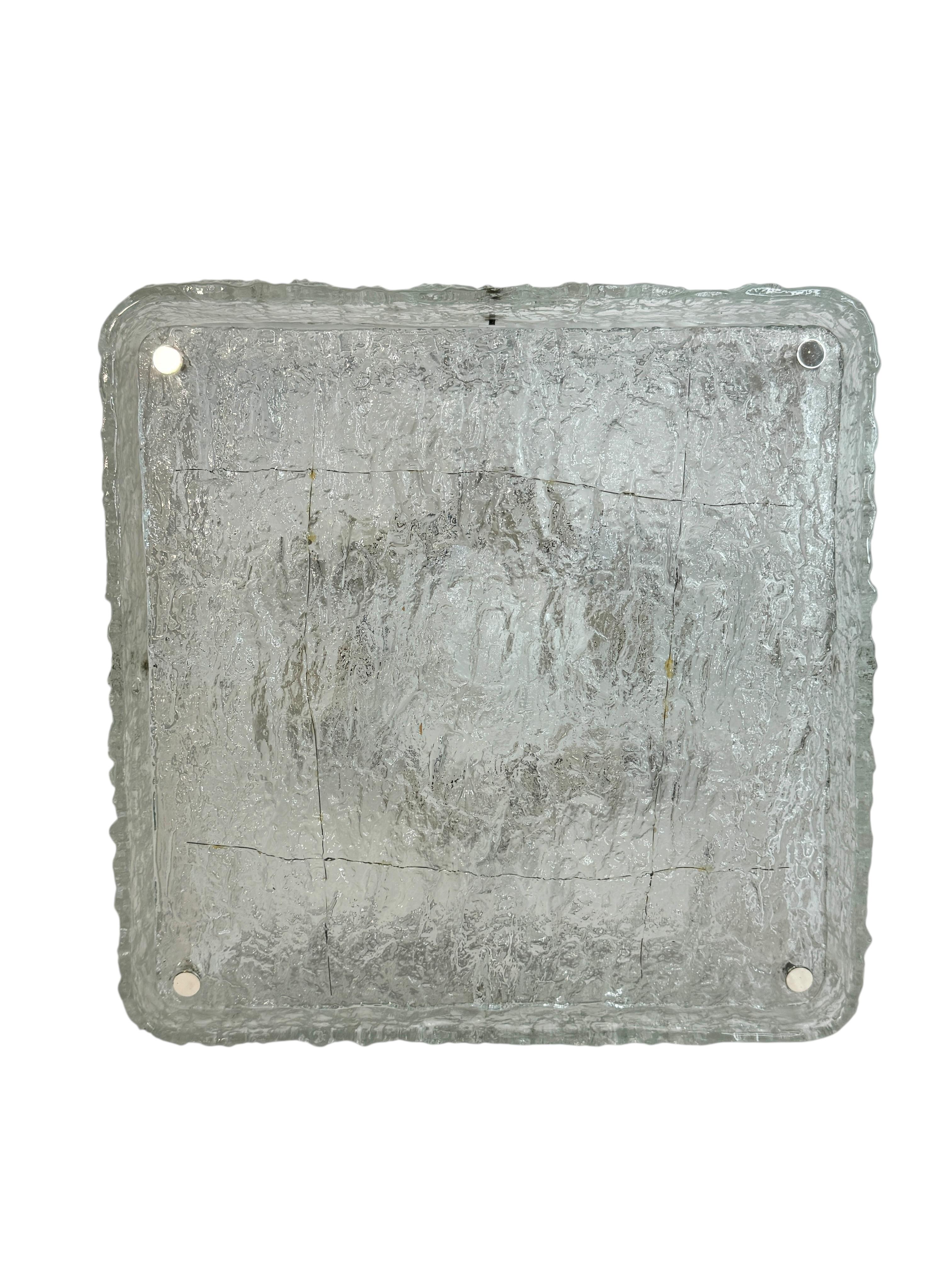 Large Kaiser Leuchten Ice Glass Flush Mount Chandelier, Germany, 1960s
A gorgeous large two-part flush mount chandelier by Kaiser Leuchten, crafted in Germany in the 1960s. This impressive square-shaped fixture features an outer glass ring and a