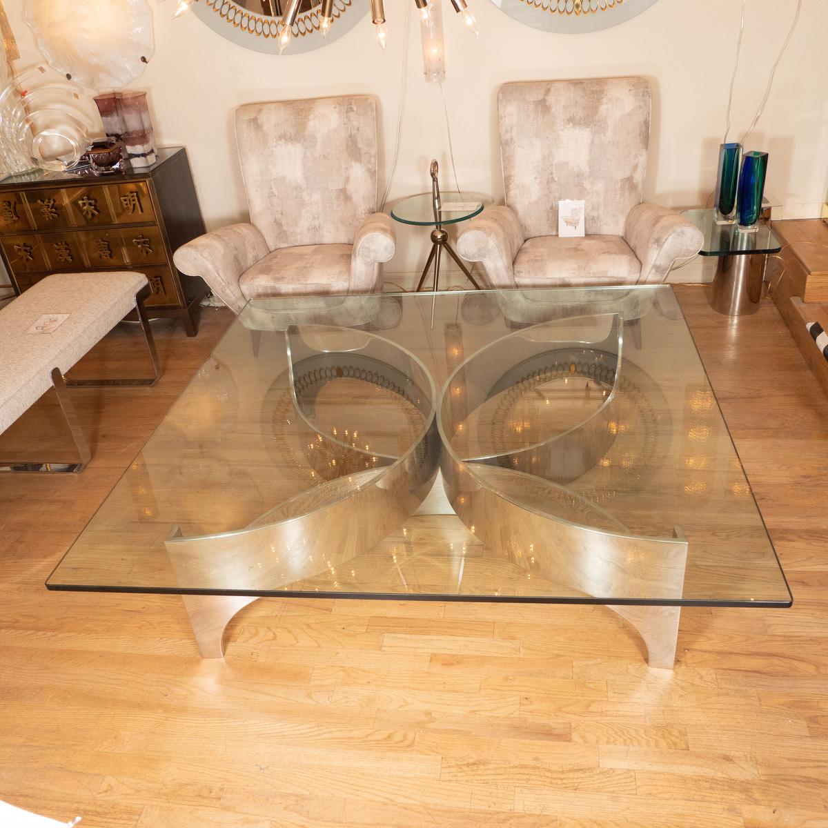 Monumental steel coffee table with square glass top attributed to Brueton. 