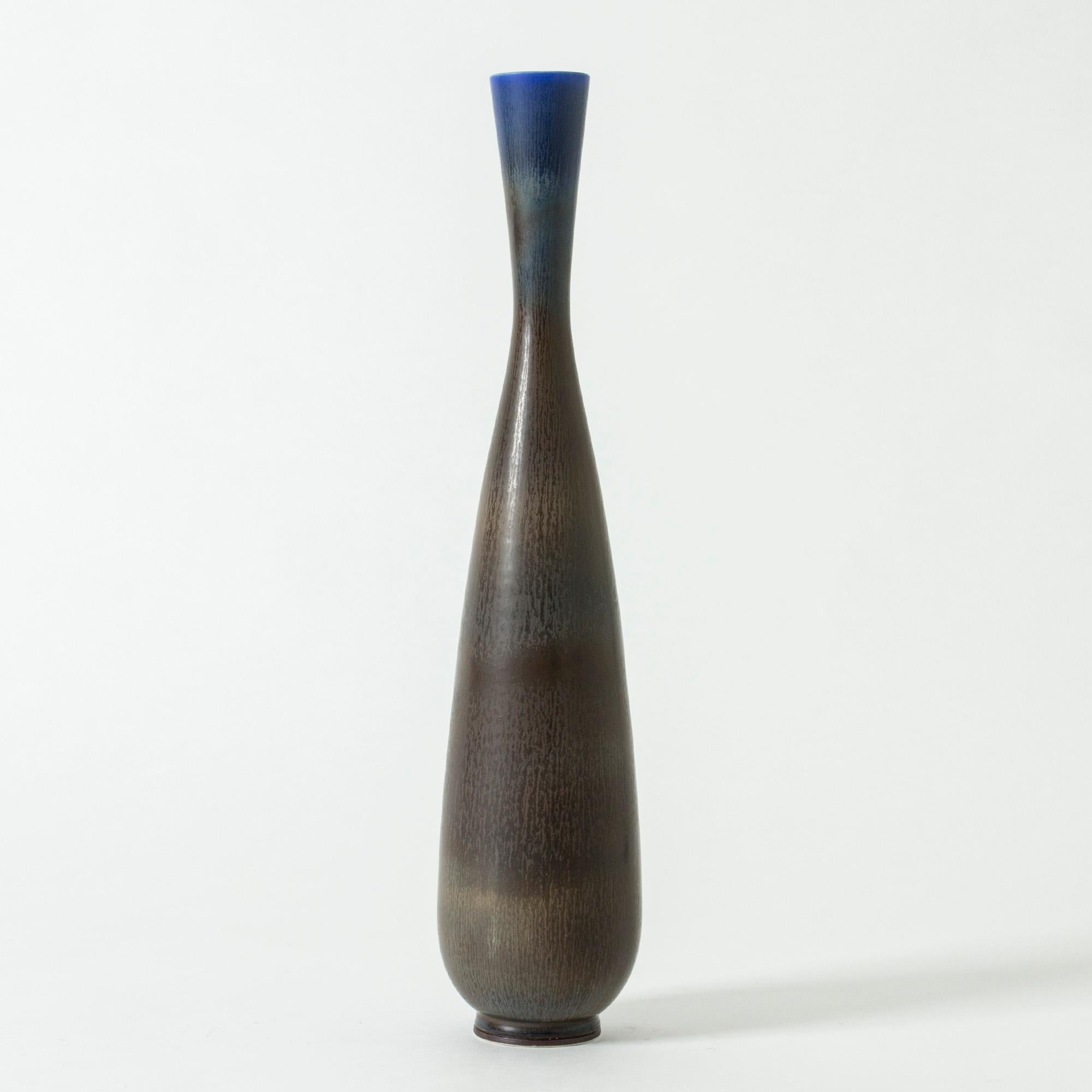 Exceptional stoneware vase by Berndt Friberg, in a rare, large size. Exquisite brown hare’s fur glaze, blending into vibrant blue at the rim.