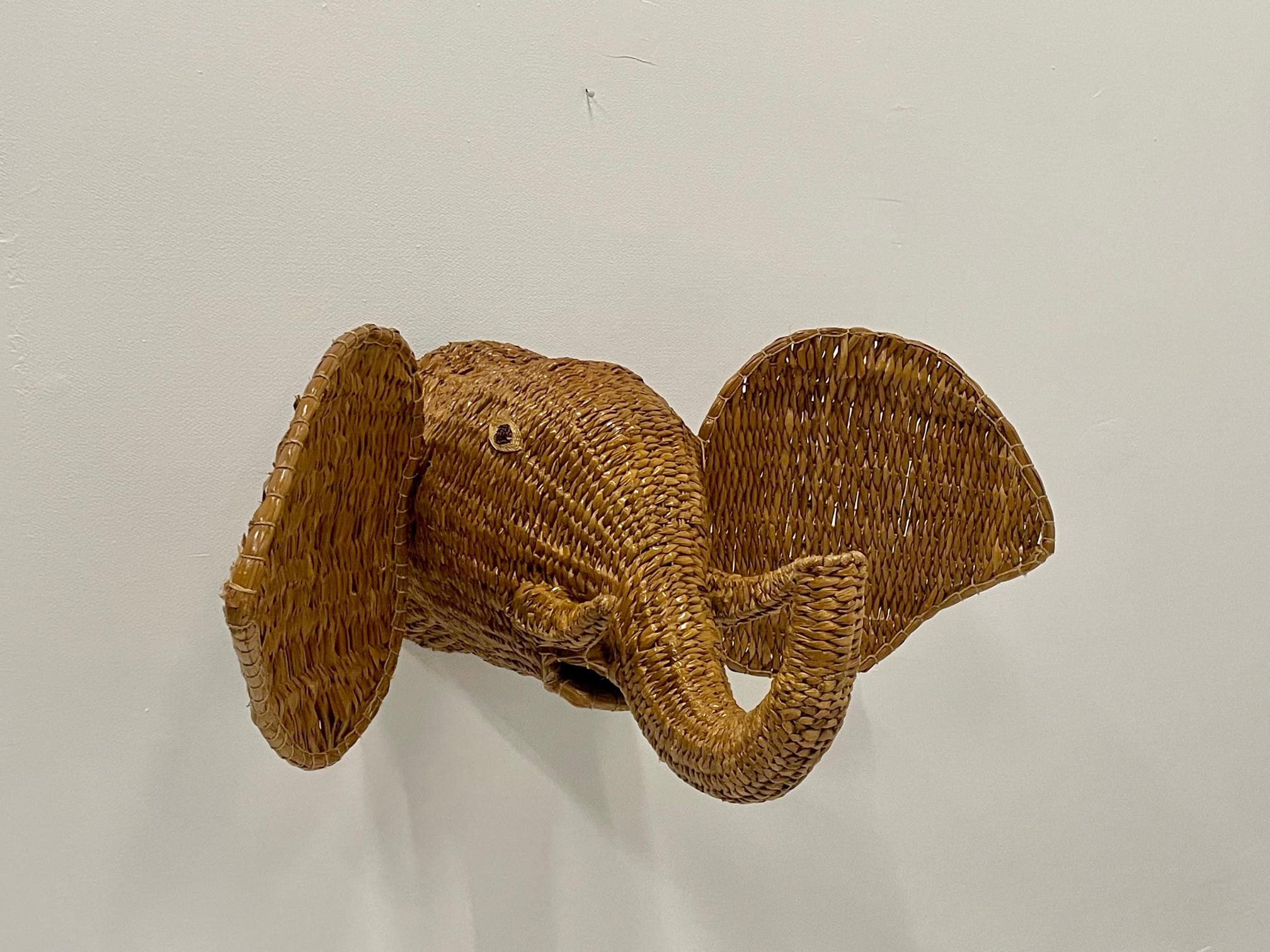 The show stealer wall decor work of art is a vintage water hyacinth elephant trophy head, whimsical and impressive in scale.