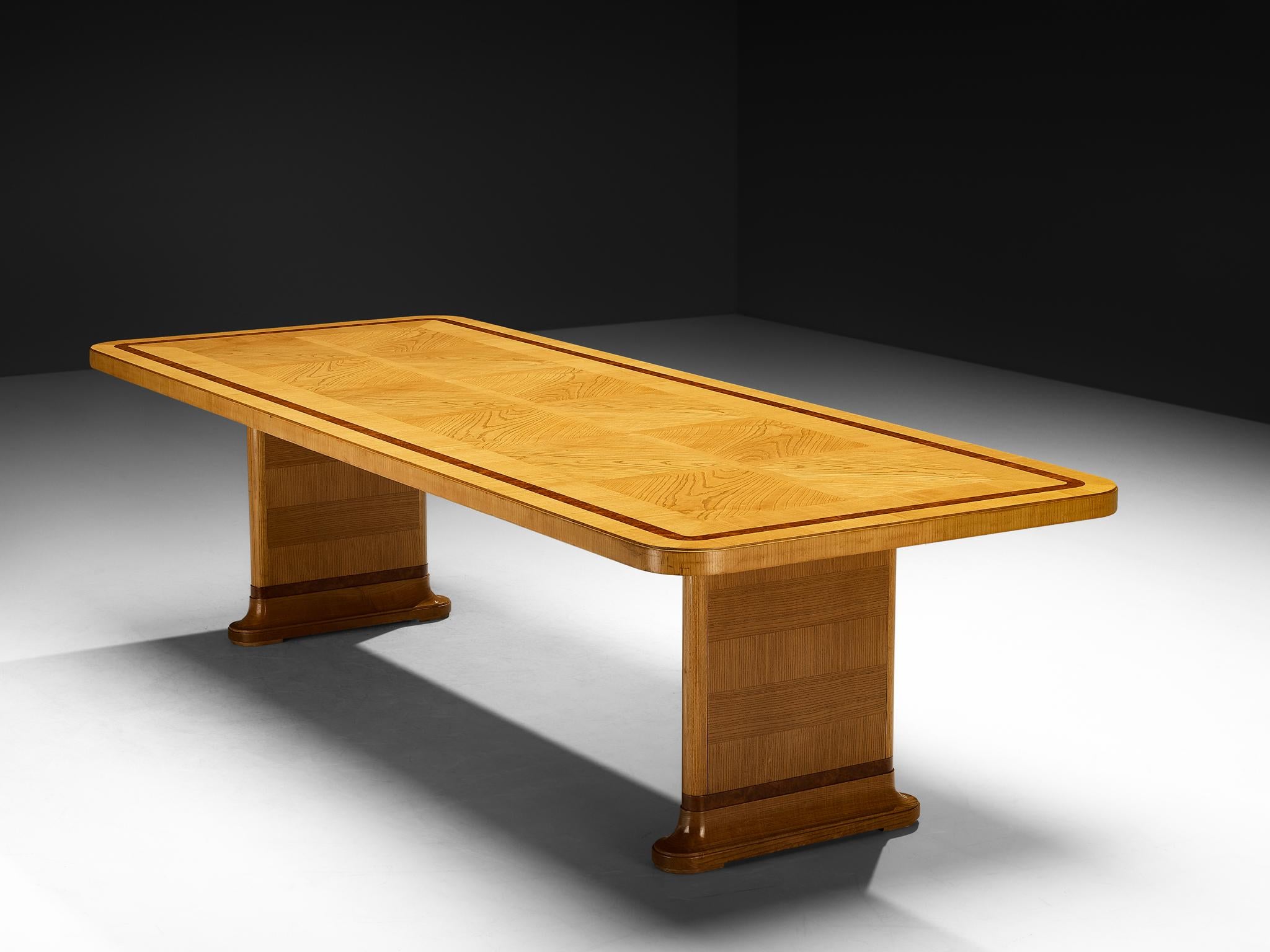 Dining table, ash, walnut burl, Sweden, 1930s

This grand 1930s Swedish dining table embodies a statuesque presence through its refined proportions and exquisite craftsmanship. The tabletop showcases a beautifully arranged ash wood surface, its